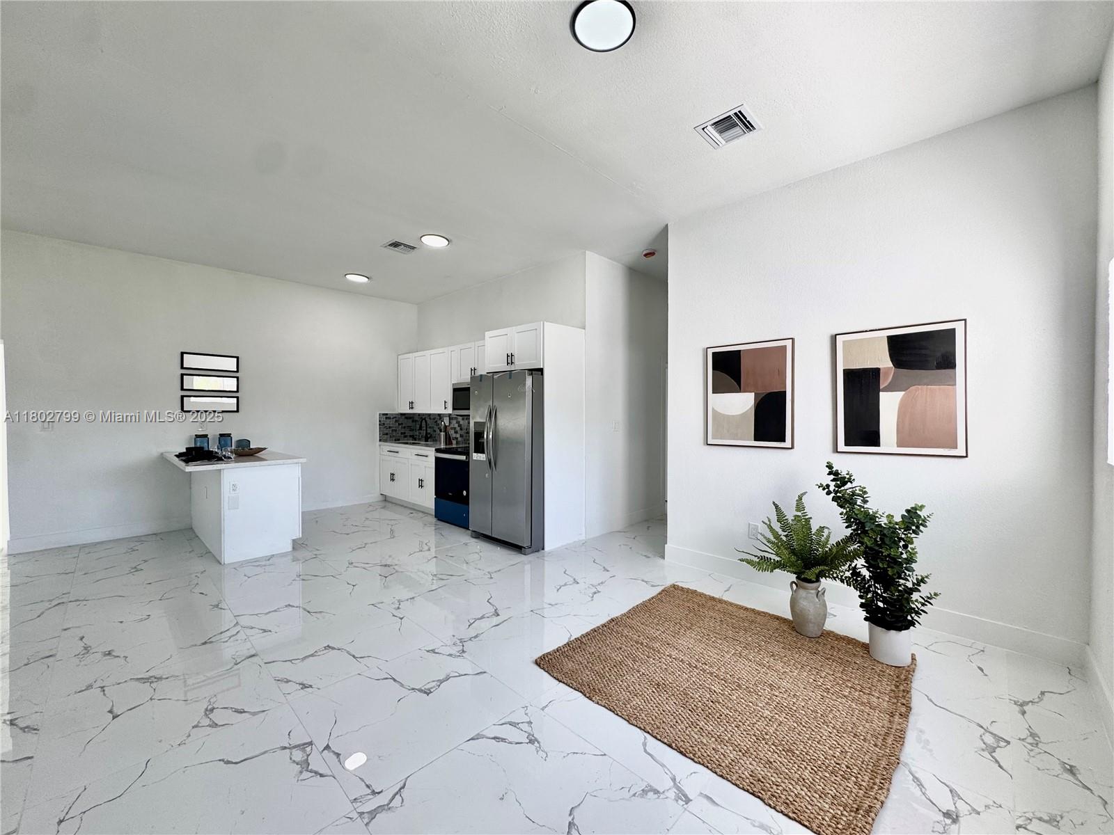 Welcome to 25 NW 193rd Street, Miami Gardens — a stylish new construction home featuring 4 spacious bedrooms and 3 modern bathrooms. This move-in-ready gem boasts high ceilings, an open layout, porcelain tile flooring, and a sleek kitchen with new stainless steel appliances. A bedroom can serve as an in-law suite or efficiency unit, perfect for guests or rental income. Impact windows and doors provide security and energy savings, while the large lot offers room to add a pool.With modern finishes and a flexible design, this home is a perfect blend of comfort, style, and opportunity in a vibrant location. Home includes alarm system and cameras.