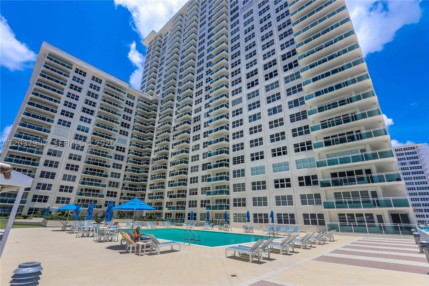 Beautifully updated 2-bedroom, 2-bathroom residence offering the perfect blend of comfort, style, and breathtaking ocean and pool views. Featuring a desirable split-bedroom floor plan, this spacious home has been thoughtfully renovated throughout.

Step inside to find new porcelain tile flooring, fresh paint, and new baseboards that create a bright, modern feel. The oversized primary suite offers exceptional storage with three closets and a luxurious en-suite bath featuring dual sinks, illuminated mirrors, and updated cabinetry. The second bathroom is equally impressive with a remote flush and bidet toilet with heated seat, glass-enclosed marble tile shower, upgraded vanity, and lighted mirror, while the main bath also includes a relaxing jacuzzi tub/shower combination.

The completely remodeled kitchen is a chef’s dream, boasting quartz countertops, a Monogram induction cooktop, stainless steel hood, microwave, and a never-used oven, along with a Miele dishwasher. A convenient in-unit stackable washer and dryer adds to the home's functionality.

Enjoy seamless indoor-outdoor living with a glass balcony accessible from the living room. Additional upgrades include impact windows and doors, updated toilets and cabinetry throughout, and the home is available partially furnished/

Residents enjoy an exceptional array of amenities, including a large community room with bar and kitchen for private events, a billiards room, two fitness centers, and a conference/meeting room.