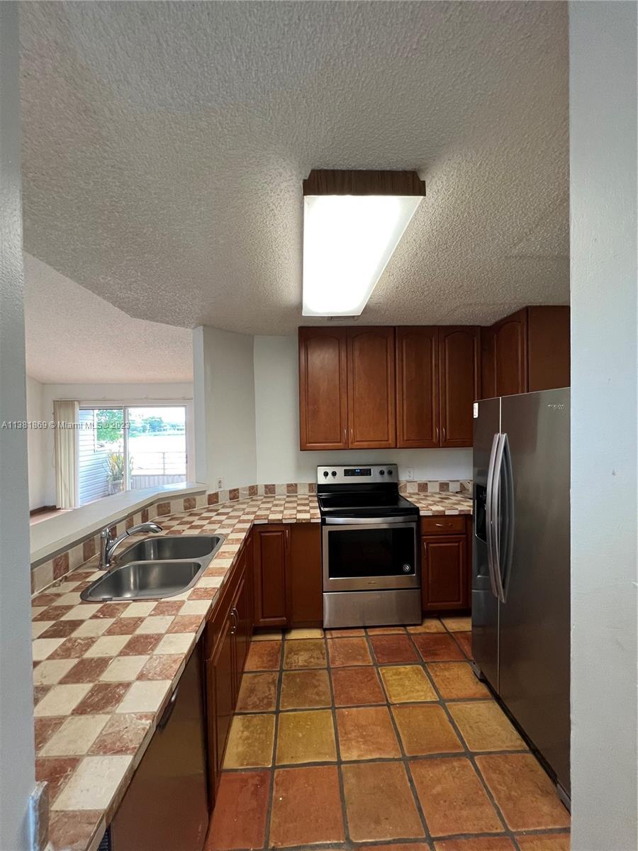 Charming 1/1 Condo on second floor with washer & dryer inside the unit. This place has Wood cabinetry, newer stainless steel appliances and laminated floors. Enjoy the large condo with vaulted ceilings and open balcony with lake view. Summer Lake is a gated community with a great lake that offers you great views and privacy. The complex features: Pool, Tennis and Basketball courts, Fitness center, Bike/jogging Path. Pets welcome.Conveniently located just two miles West of I95 and half mile East of the Turnpike. Easy to show, Vacant.