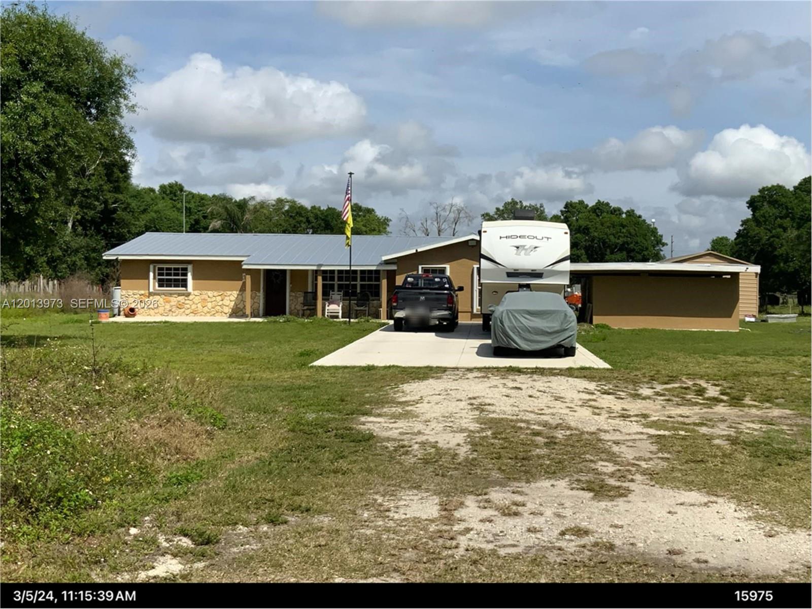 Escape the noise and step into your own private slice of country living in LaBelle, Florida. This versatile property is perfect for anyone looking to start a farm, create a homestead, or simply enjoy wide-open space while still being conveniently close to everyday essentials like shopping, banks, and local restaurants. The land is thoughtfully set up for rural use, featuring divided pastures ready for livestock and a massive barn ideal for housing farm animals, equipment, or feed. Whether your're raising animals or planning a hobby farm, this property gives you the space and flexibility to make it your own. A standout feature is the large workshop, complete with a car lift-perfect for mechanics, car enthusiast, or running a home-based business. In addition, two storage containers provide plenty of extra space for tools, equipment, or supplies. When it's time to relax, enjoy the huge in-ground pool-ideal for cooling off on warm Florida days or entertaining friends and family. The expansive concrete driveway offers ample parking for vehicles, trailer, RVs, or farm equipment. This property truly offers the best of both worlds: peaceful rural living with the convenience of town just a short drive away. Opportunities like this don't come around often-bring your vision and make it yours!