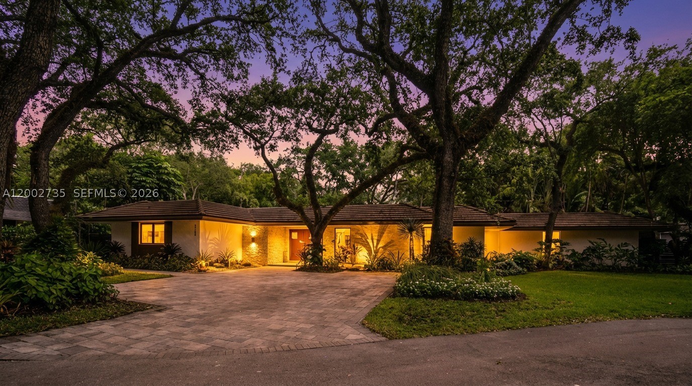 Exquisitely designed and fully upgraded 5-bedroom, 4.5-bath residence located on a quiet cul-de-sac in the highly sought-after Skylake area. This one-story home offers a refined living experience, combining sophisticated design, expansive spaces, and exceptional attention to detail.

Thoughtfully curated and beautifully decorated, the home showcases a seamless flow between indoor and outdoor living, with generous living areas, high-end finishes, and a modern kitchen equipped with stainless steel appliances and gas connection.

The outdoor setting is truly remarkable, featuring lush, mature landscaping that creates a private, serene, resort-like atmosphere surrounding a stunning infinity-edge pool—ideal for both relaxation and entertaining.

A standout feature of the property is a fully equipped, custom-built gym, designed for a complete wellness experience within the comfort of your own home.

Additional highlights include impact windows and doors, generator, maid’s quarters, electric vehicle charging station, and a spacious driveway accommodating multiple vehicles.

A rare opportunity to own a move-in ready, design-forward home offering privacy, comfort, and elevated living in one of the area’s most desirable neighborhoods.
