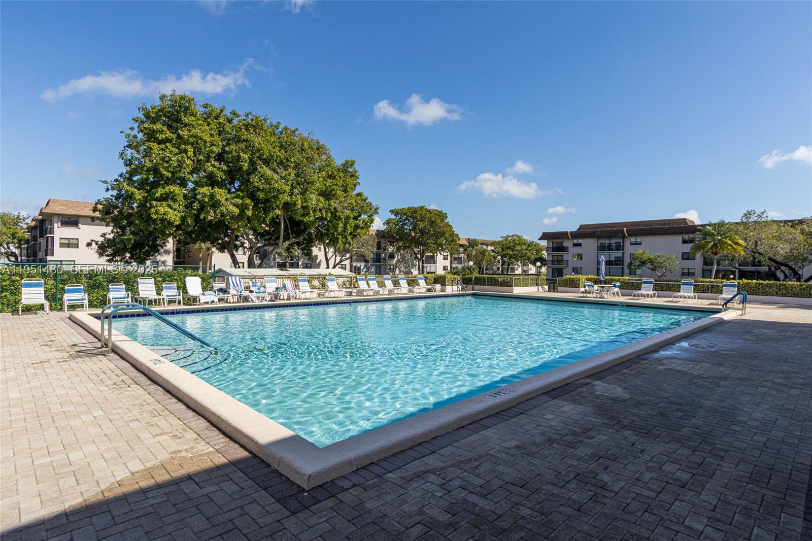 This competitively priced two-bedroom, two-bathroom unit offers modern conveniences and amenities. Featuring a 2025 air conditioning system and an in-unit washer and dryer, this residence ensures comfort and ease. The monthly fee includes cable and internet services. Residents can enjoy a heated pool, tennis courts, a billiards room, and a community room with various activities. Conveniently located close to all essential amenities, this property is an exceptional opportunity.