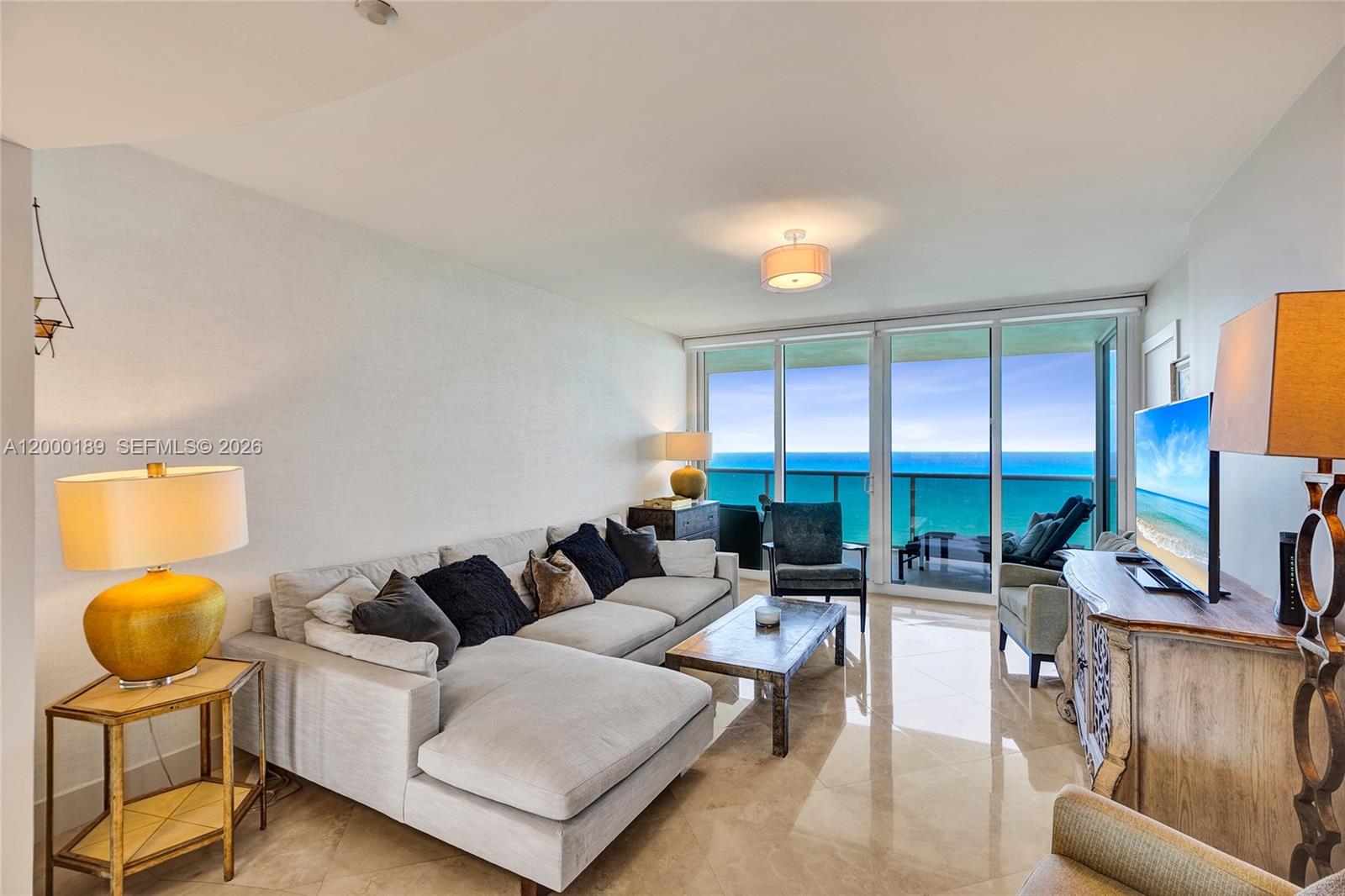 Direct oceanfront residence at Ocean Two featuring a flow-through 3BR/3BA layout with 2,150 SF, private elevator foyer, and two balconies offering unobstructed ocean and Intracoastal views. This bright home includes a modern kitchen, luxury finishes, and an enclosed den functioning as a third bedroom with ocean views, walk-in closet, and full bath. Separate laundry room and one assigned parking and storage. Pet friendly. Enjoy resort-style amenities: beach service, heated oceanfront pool, spa, fitness center, two tennis courts, children’s playroom, oceanfront café, valet, 24-hour security, concierge, and paddleboard/kayak storage. Prime Sunny Isles Beach oceanfront living in a full-service building
