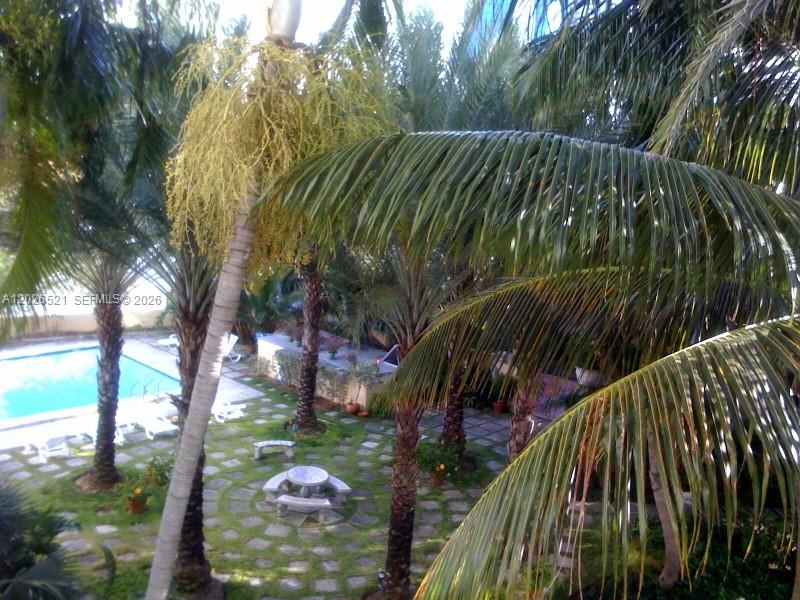Available June 15 for a one year lease or longer. Across from the ocean in adorable tree-lined neighborhood. Rare offering: spectacular furnished corner unit in famous Helen Mar Condo. Gorgeous updated oversized studio. Bright & sunny with 10ft ceilings, tile floors, updated kitchen with stainless steel appliances, modern bath with glass shower, spacious living area with decorative fireplace, large closet, & washer/dryer in unit. Building has a dedicated parking lot, beautiful lush gardens with pool & BBQ area and is in the perfect location- cross the footbridge to the ocean or stroll to Lincoln Road in minutes.