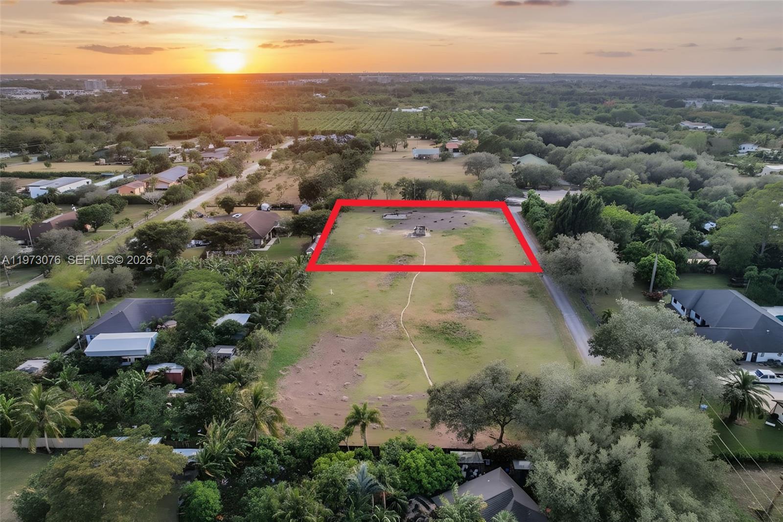Welcome to Redlands Reserve, a rare offering of two side-by-side 1-acre cleared estate parcels with paved road frontage in the highly desirable Redlands area. Available individually or together as a full 2-acre opportunity, these buildable homesites provide exceptional flexibility for both end users and builders. Each acre is a separate legal parcel with its own well utilities in place, allowing for the construction of two private estate homes or one expansive luxury compound. The cleared condition reduces site preparation costs and allows for immediate planning and development. Design a custom residence with room for a guest house, resort-style pool, tennis court, detached garage, equestrian features, or expansive outdoor living spaces. In addition to residential use, the property may allow for agricultural-related business uses (buyer to verify zoning and permitted uses with Miami-Dade County), offering added versatility and long-term potential. Enjoy peaceful acreage living surrounded by estate properties while remaining just minutes from major roadways, shopping, and dining. No HOA. An exceptional opportunity to secure space, privacy, and lasting value in one of South Florida’s most sought-after acreage communities. See next door lot MLS#A11972997
