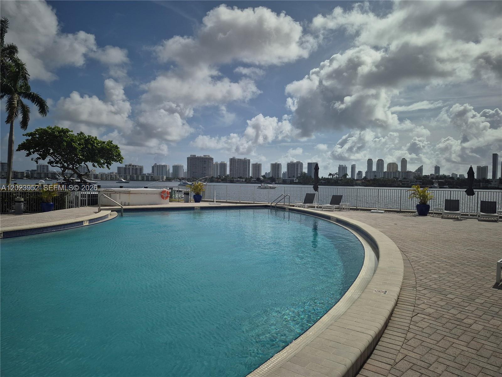 A must see beautiful 1 bed 1.5 bath with wooden floors. Unit has a wonderful view and impact windows. This building has a new lobby and new lounge. The property sits in a most amazing location. Short distance to malls, pubs, Sunny Isles restaurants and Oleta River State Park. Secure area and building and 40 years certification passed. Enjoy resort style amenities in a gated community. This gorgeous unit also includes a Boat slip for upto 30 ft boats and with low monthly payment to the association. Dont miss this unique opportunity.