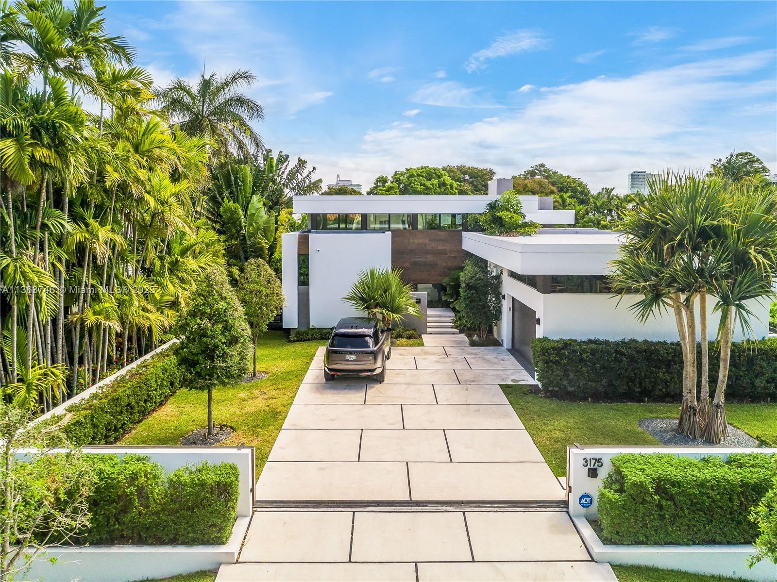 Modern Architectural Masterpiece designed by Praxis Architecture + Design & built by Prieto Development in 2021. This stunning luxury home sits on oversized 14,100 SF lot steps from Miami Beach Golf Club. One story home w/a total of 5,180 SF of seamless indoor/outdoor living space. Open floor plan perfectly designed for entertaining,10- & 15-foot ceilings & plenty of natural light make these 4 beds,5.5 bath home one of a kind. Italian Design Kitchen w/ top of the line appliances. Large main Bedroom w/ two walk-in closets & elegant main bathroom with double shower. Outdoor terrace w/ beautiful swimming pool, summer kitchen and lush vegetation. Two car attached garage, and smart-home technology set up.NOTE* Home was designed and built to add a 2nd story w/additional 1,800 SF of living space.