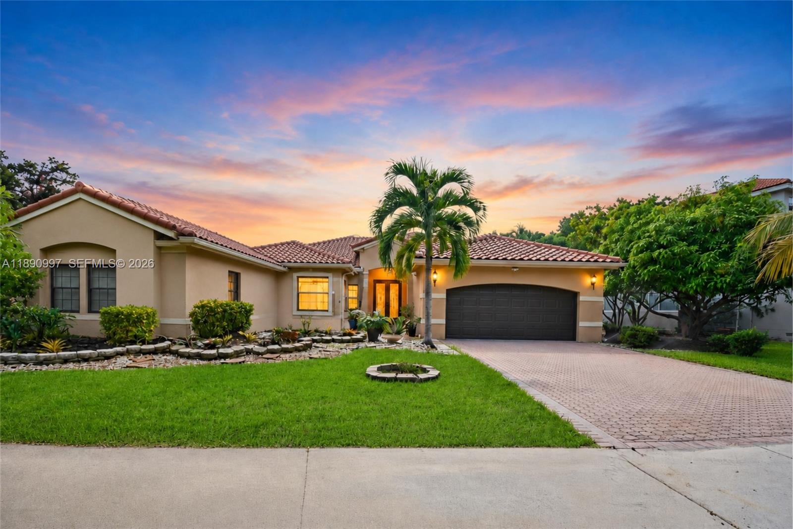 Beautiful one-story residence located in the gated community of The Lakes in Weston, offering approx. 3,000SF of living space on an ample 11,299SF lot with plenty of room to add a pool. This 5-bed, 4-bath property features a great split floor plan designed for comfort and privacy. The property features porcelain flooring in the social areas, tile flooring in all bedrooms, full impact windows and doors, fully updated bathrooms, and an updated kitchen with beautiful views of the patio and plenty of storage. The oversized primary suite features his and hers walk-in closets and a fully updated bathroom with dual vanities, rainfall shower, and a tub. The additional bedrooms are located on the opposite wing and include one large ensuite bedroom, while 2 spacious bedrooms share a bathroom with dual vanities. Another bedroom, currently used as an office, is located next to the cabana bathroom. The outdoor area offers excellent potential to create your own backyard oasis. The existing screened patio can be easily expanded to maximize outdoor space and accommodate a large pool, summer kitchen, lounge area, and entertainment space, making it an ideal setting for outdoor living and entertainment. The property also includes 38 fully paid solar panels. Ideally located near Weston’s top-rated schools, parks, dining, shopping, and major highways, this property offers both comfort and convenience in one of Weston’s most desirable communities. Move-in ready!