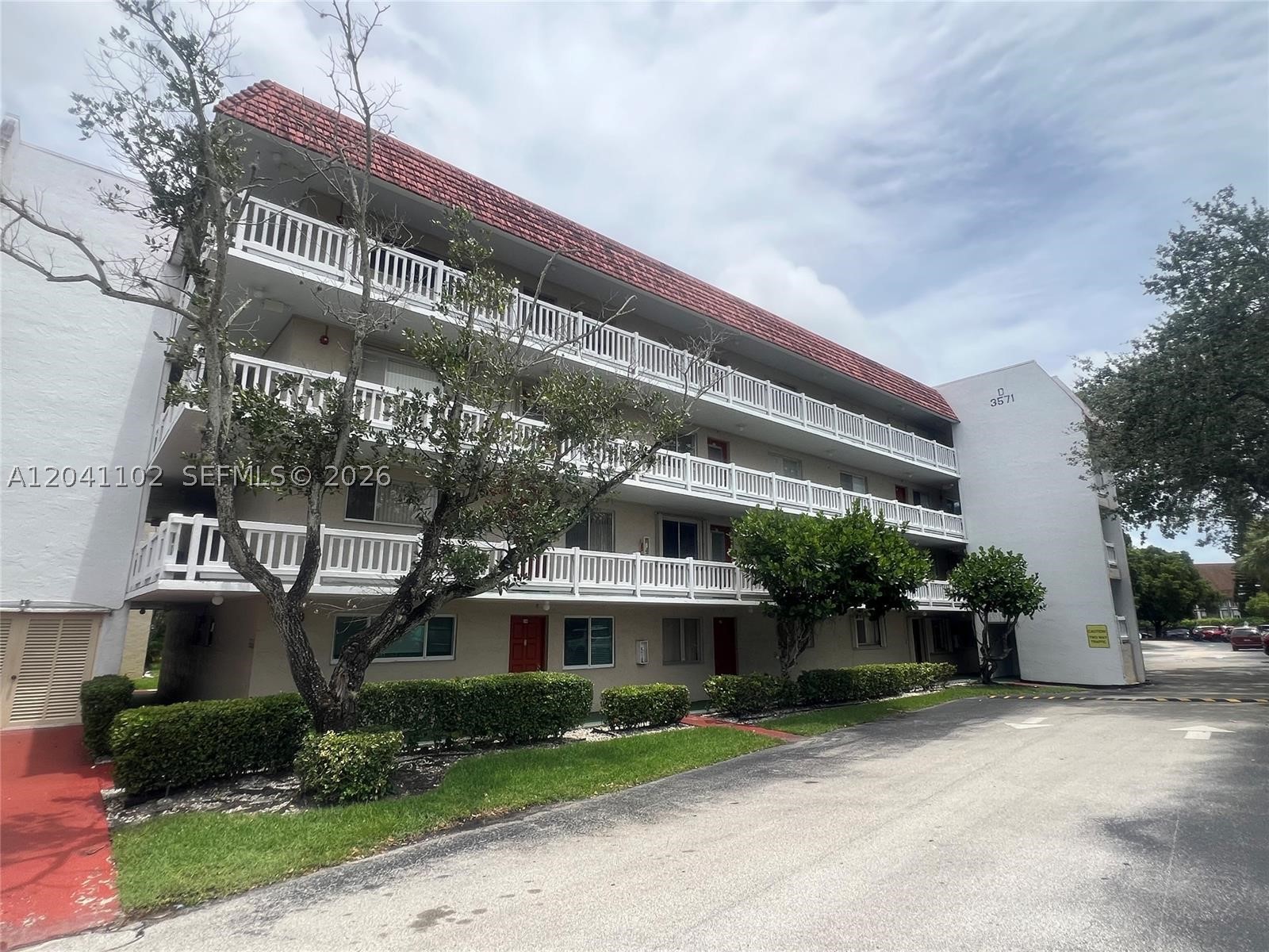 Spacious 2-bedroom, 2-bathroom condo in a secure gated 55+ community. Enjoy peaceful views of the lake, pool, and landscaped gardens from the oversized private balcony. The thoughtfully designed floor plan offers generous living space, while the primary suite features two walk-in closets for ample storage. Laminate flooring extends through the main living areas, complemented by tile flooring in the kitchen and hallway. An in-unit washer and dryer add everyday convenience.

The elevator-equipped building provides easy access, and residents enjoy an array of amenities, including a golf course, swimming pools, fitness center, shuffleboard courts, and clubhouse. One assigned parking space is included, along with abundant guest parking.