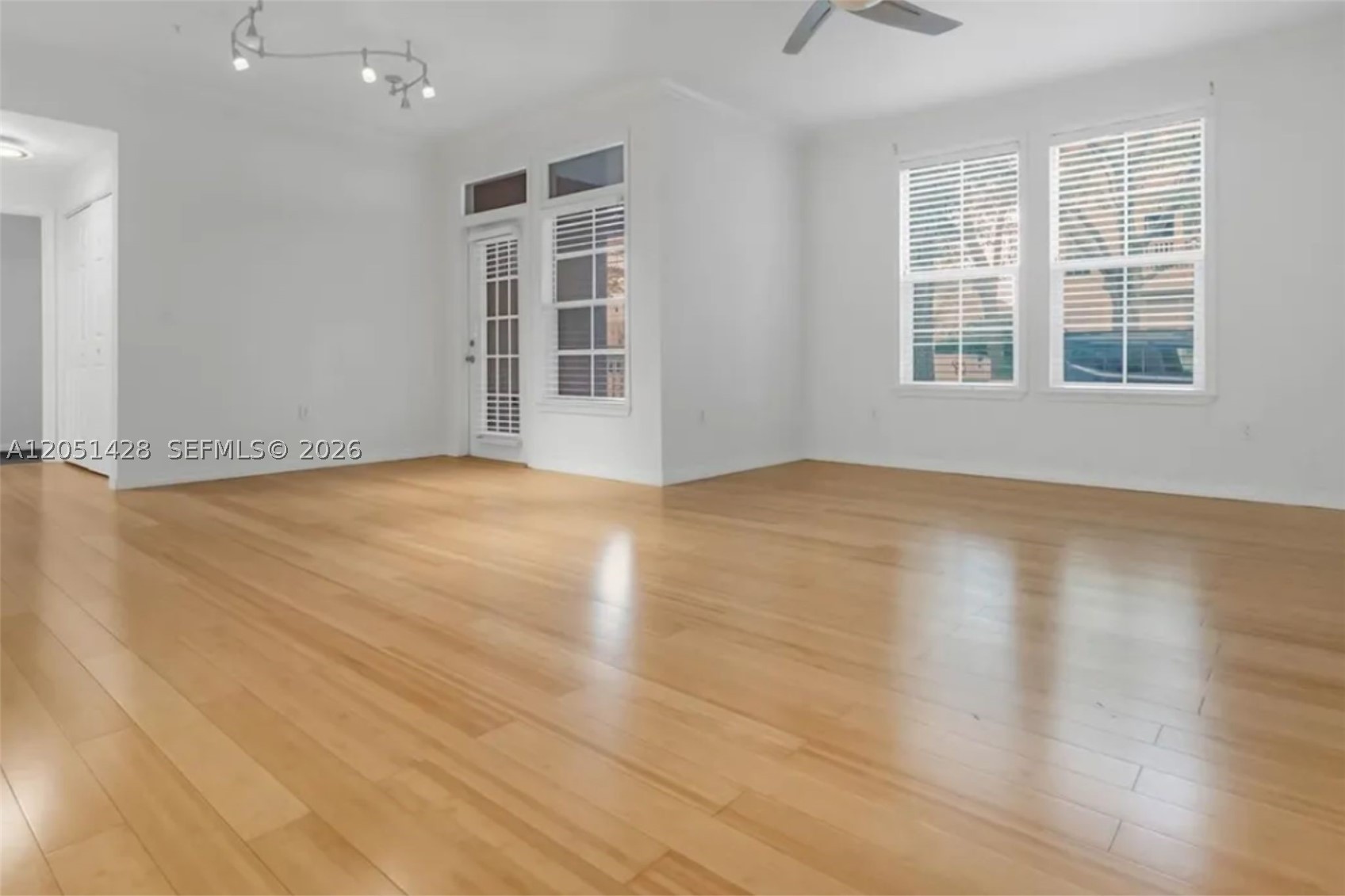 Bright and inviting 2BR/2BA corner residence in the sought after Water Street condominium, ideally positioned in the heart of Celebration. Features an open-concept layout with hardwood flooring throughout the main living areas, a spacious living and dining area, and a kitchen with granite countertops, stainless steel appliances, and a breakfast bar. The generous primary suite and secondary bedroom provide comfortable accommodations, while a rare covered patio—one of only two in the community—offers an inviting outdoor retreat. Residents enjoy premium amenities including a fitness center, business and social rooms, concierge trash service, and reserved downtown parking. Just steps from Celebration's vibrant town center with its charming shops, restaurants, cafés, lakeside paths, parks, community pools, and miles of walking and biking trails. Conveniently located near top rated schools, major highways, Walt Disney World, and Central Florida's most popular attractions.