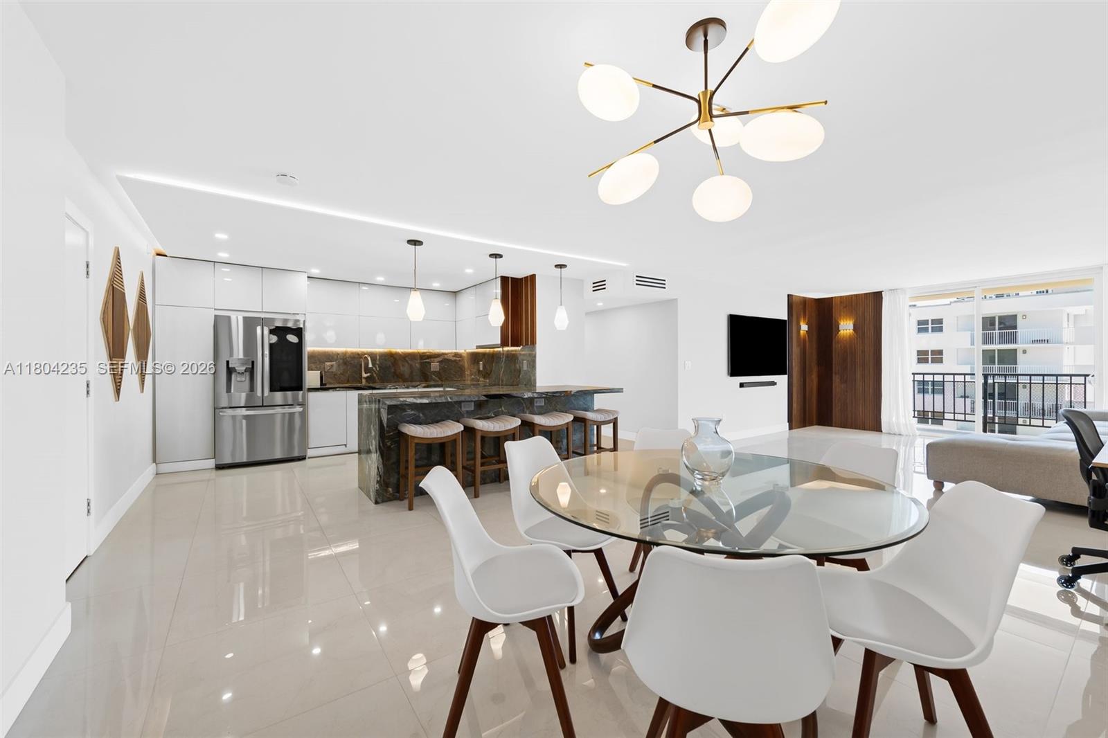Welcome to this meticulously renovated unit where modern comfort meets coastal luxury. Enjoy panoramic views of the ocean, Intracoastal, and sunset city skyline from your private balcony. High-end finishes and stylish design make this a move-in-ready retreat. Just steps from the world-famous Hollywood Beach Broadwalk—ranked a top 5 U.S. beach by TripAdvisor—offering oceanfront dining, shops, and entertainment. Ideally located between Miami and Fort Lauderdale with convenient access to airports, fine dining, shopping, and top entertainment. Whether you're searching for a vacation retreat, seasonal getaway, or a year-round tropical residence, this unit offers the perfect blend of lifestyle, location, and value.