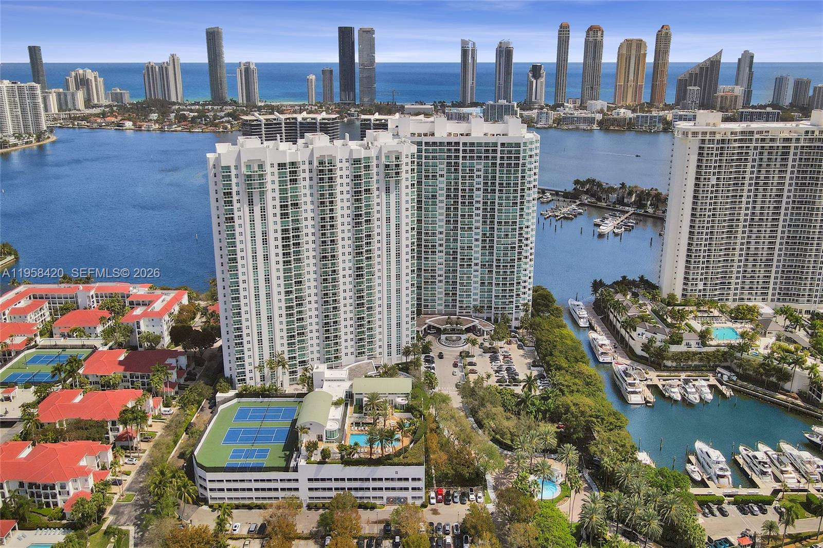 This 23rd-floor 2B/2.5B + a Den, condo offers 2,970 SF of elegant living with breathtaking panoramic ocean, Intracoastal, and skyline views. A private elevator foyer provides direct access to the unit. The flow-through layout features marble floors, impact windows, and expansive east and west terraces ideal for sunrise, sunset, and nighttime skyline views. Enjoy cooking in your kitchen with ocean-blue views and entertaining in the living areas with relaxed coastal vibes. The spacious primary suite includes terrace access, a walk-in closet, and an oversized spa-style bath. Located in The Peninsula One, a full-service waterfront community with luxurious amenities, minutes from Aventura Mall, beaches, dining, A-rated schools, parks, and more.