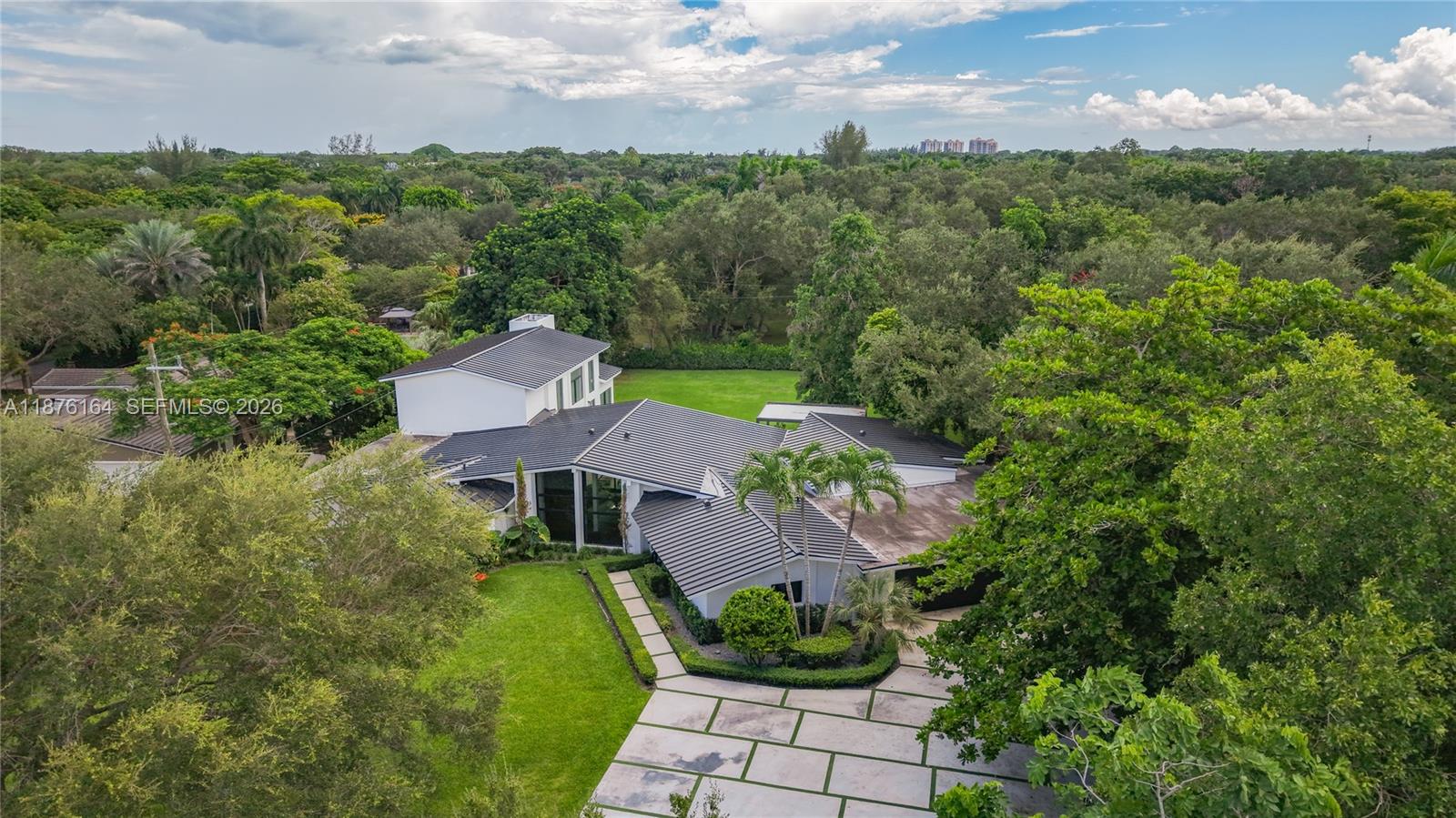 Nestled on over an acre of lush, private grounds in sought-after Pinecrest, this stunning 5-bedroom, 5.5-bathroom residence offers over 6,000 square feet of elegant living space designed for comfortable family life and entertaining.
Step inside to discover a beautifully updated interior featuring a brand-new kitchen with premium finishes, spacious living areas filled with natural light, and a seamless indoor-outdoor flow. The home’s transitional style blends clean lines with warm accents, creating an inviting yet refined atmosphere. The oversized backyard offers endless possibilities.
In one of South Florida’s most desirable neighborhoods, this home is minutes from top-rated schools, parks, and dining—ideal for families seeking luxury, space, and convenience in a prime location.