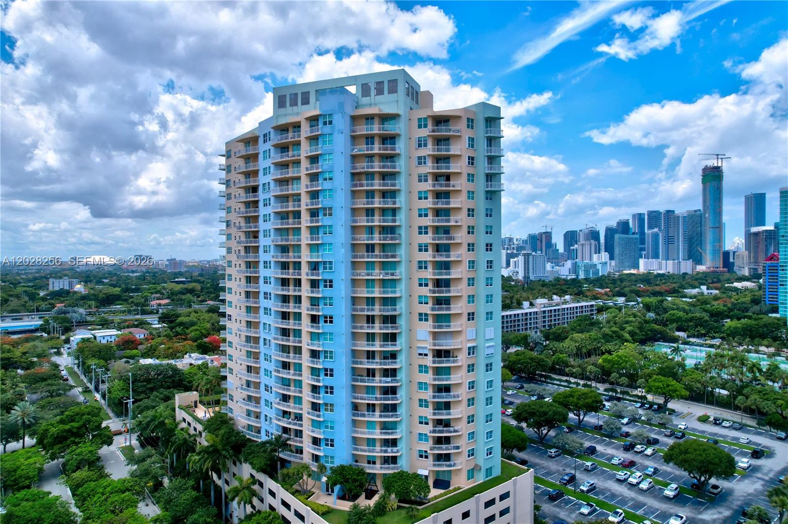 Enjoy breathtaking panoramic views of Biscayne Bay, Vizcaya, Key Biscayne, and Coconut Grove from this great corner unit. One of the few residences in the building with balconies off both the master bedroom and the living/dining area. The remodeled kitchen features modern cabinetry, stainless steel appliances, designer backsplash, and quartz countertops. Bamboo flooring throughout, California-style closets, and a desirable split-bedroom floor plan that provides privacy and abundant natural light. The unit includes 2 side-by-side parking spaces and a private storage unit. Enjoy exceptional amenities including complementary valet parking (a rare Bickell feature), tennis court, pool, sauna, fitness center overlooking the pool area, BBQ area, children's playground, community room, media room, and on-site management. Prime Brickell location with easy access to I-95, US-1, Coconut Grove, and Key Biscayne. Close to shopping, dining, and entertainment in trendy Brickell. No assessments.