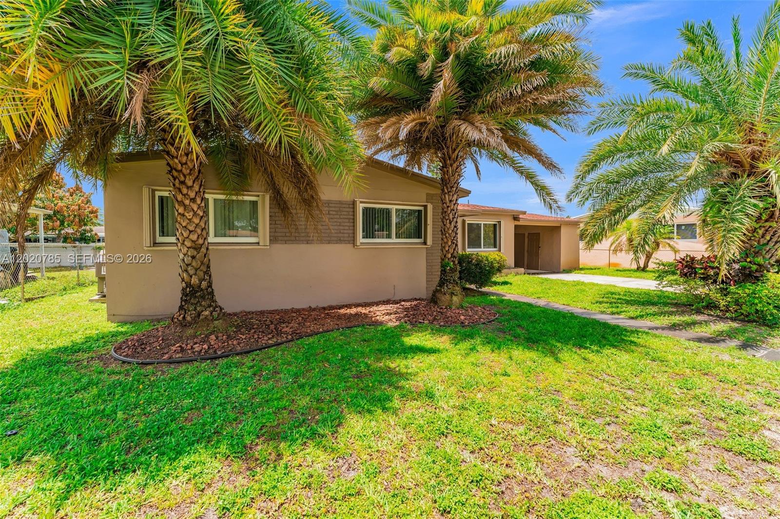Beautiful Single-Family Home. Discover this charming 3-bedrooms, 1-bathrooms with an in-law suite that consist of 2- bedrooms, 1- bathrooms. This property offers both comfort and accessibility. Step inside and be greeted with natural light thanks to the abundance of Impact windows which provides energy efficiency. The heart of the home is the kitchen, wood shaker cabinets, with Stainless steel appliances. This Spacious oasis comes complete with plenty of living and backyard space. Conveniently located near retail stores, supermarkets, and with easy access to major roads, including the Turnpike and Hardrock stadium.