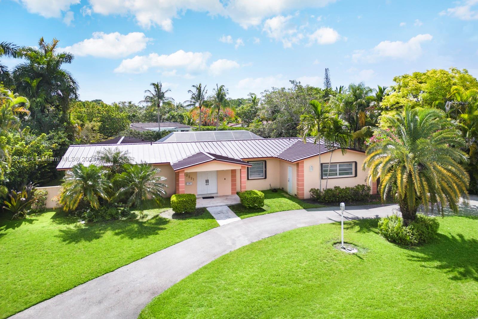 Ideal family home on a great child-friendly and quiet north Pinecrest street on a wide canal. 3 huge bedrooms plus an office off the master.  New 2021 metal roof, full accordion shutters, 2020 5-ton AC and more!  Nicely updated in some parts including newer bathrooms and somewhat newer kitchen and in great condition and spacious otherwise.  Original builder's "model" with oversized rooms (so layout could be adjusted to add a 4th bedroom if needed), big covered pool-patio area, very private lot,  small boat ramp, and loads of closet space.  Pinecrest elementary.
