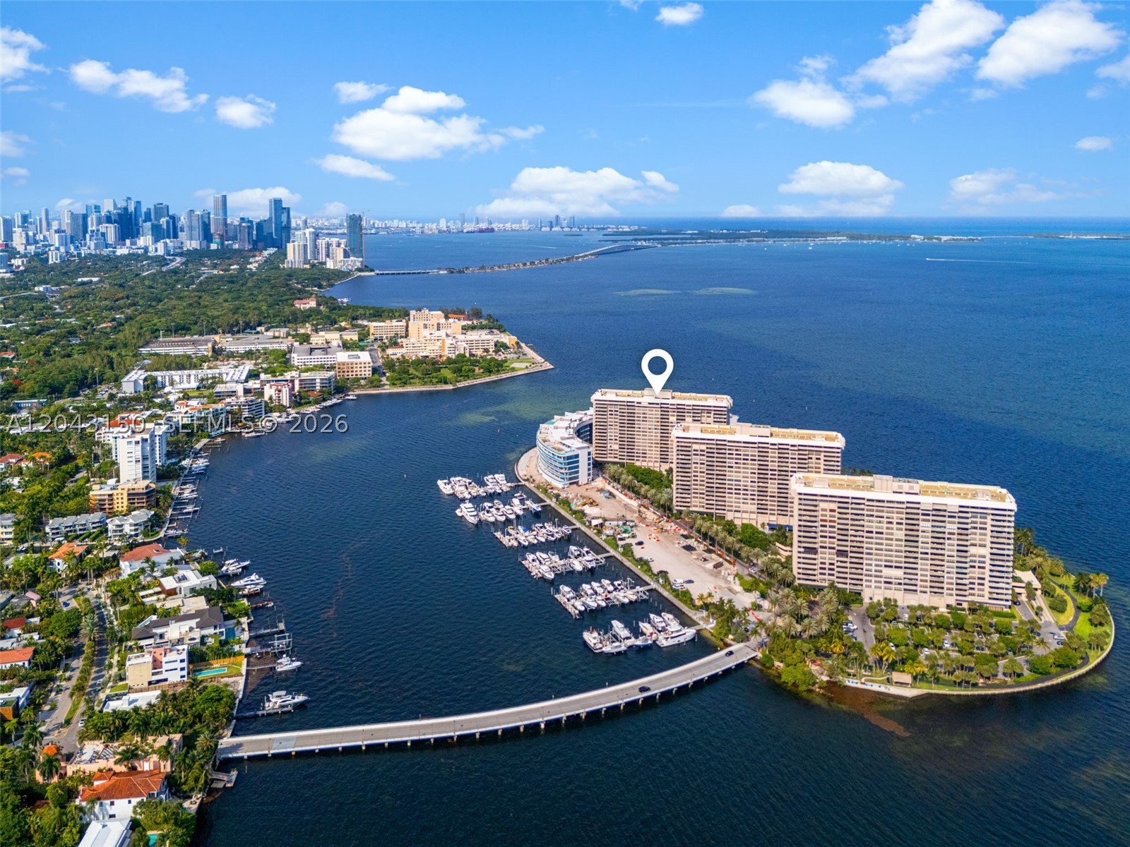 Experience elevated waterfront living in this highly desirable corner residence at Grove Isle, offering unobstructed bay and sunset views from every angle. The residence showcases expansive entertaining spaces, a wrap-around terrace, and curated finishes including marble flooring and custom detailing. With three bedrooms, generous storage, and a recently updated A/C system, this home blends comfort with sophistication. Enjoy world-class amenities including 24-hour security, resort-style pools, fitness center, private marina, walking path, tennis, padel, valet, and more. Minutes from the heart of Coconut Grove, Kennedy Park, Brickell & Key Biscayne.