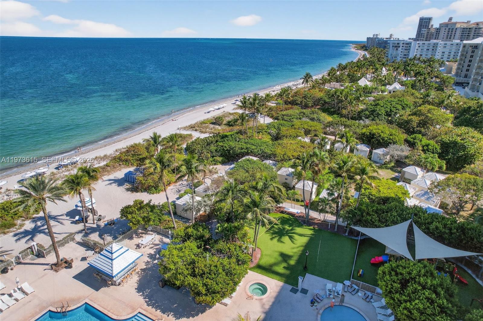 Commanding breathtaking Atlantic vistas from its privileged eighth-floor setting at Grand Bay Tower, this exceptional residence is a rare offering on the island of Key Biscayne. Originally conceived as a three-bedroom, five-and-a-half-bath home, it has been masterfully reimagined into a grand two-bedroom, three-and-a-half-bath layout, enhancing scale and flow for refined entertaining and effortless daily living. With approximately 3,950sf, the expansive living and dining areas, a welcoming family room, and a bright kitchen with breakfast area are complemented by three terraces totaling about 595sf that are seamlessly integrated throughout the residence. Custom woodwork by renowned designer Juan Montoya enriches the interiors, while the serene primary suite offers a secluded sitting room, bespoke closets and a spa-inspired bath, completing this exceptional oceanfront retreat. One storage unit is included. Separate guest quarters and an additional storage unit are available for purchase separately.