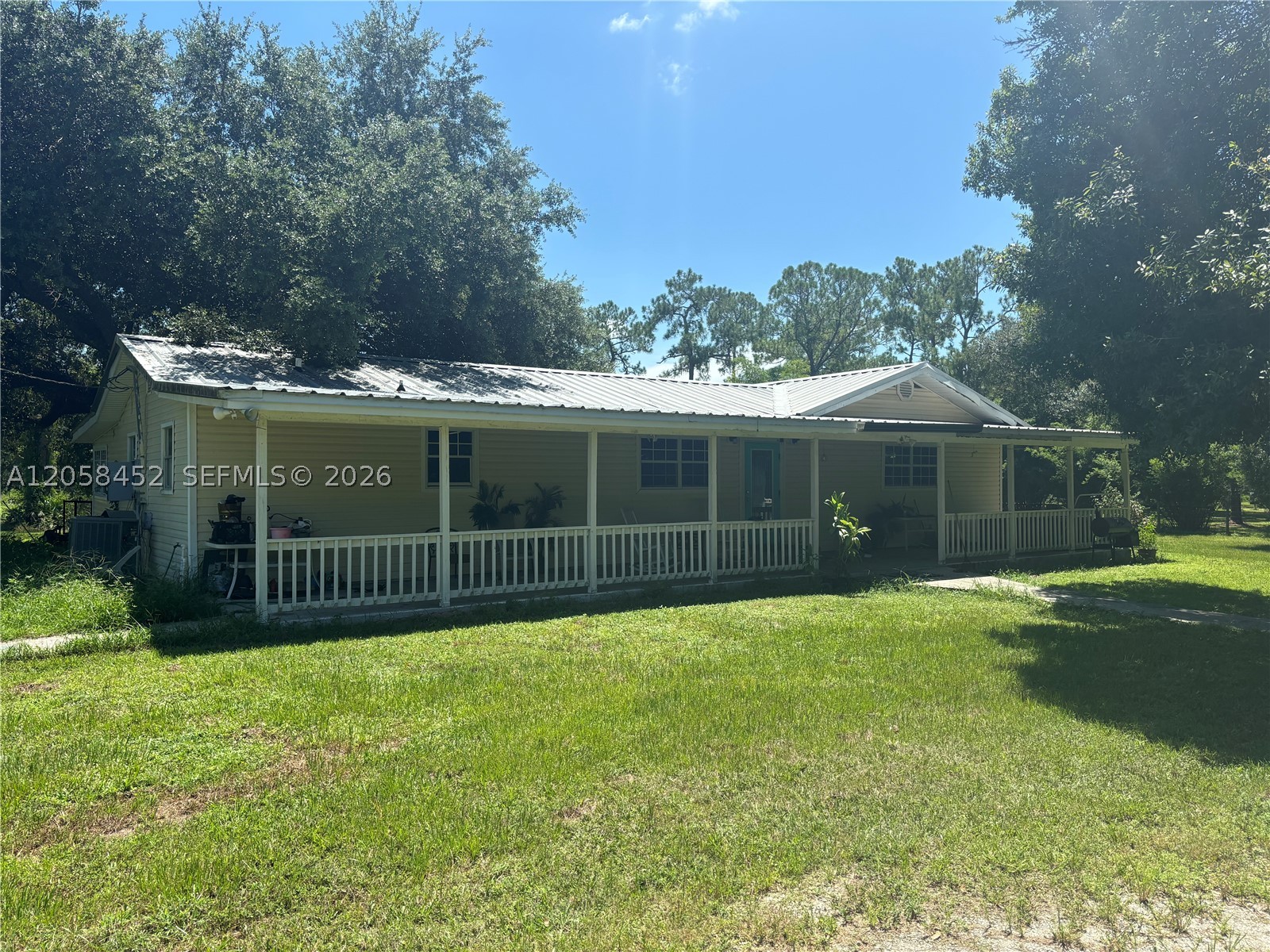 Investor's Dream on 4.85 Acres. Endless Potential and Priced Correctly. A spacious 3,000Sqft single family home and a massive 6,180Sqft barn. Located on Pollywog Street that ends in a dead-end this property offers privacy. The main home was built in 1986 it is 3 bedrooms and 2 bathrooms with a den that can be another bedroom with its own exit to the yard. This is a perfect canvas for a full renovation or a custom redesign. The barn has 3,900sqft of covered concrete slab and 2,280 enclosed storage space with electricity and running water. The property also has another entrance from Sioux Ave from the back of the property.