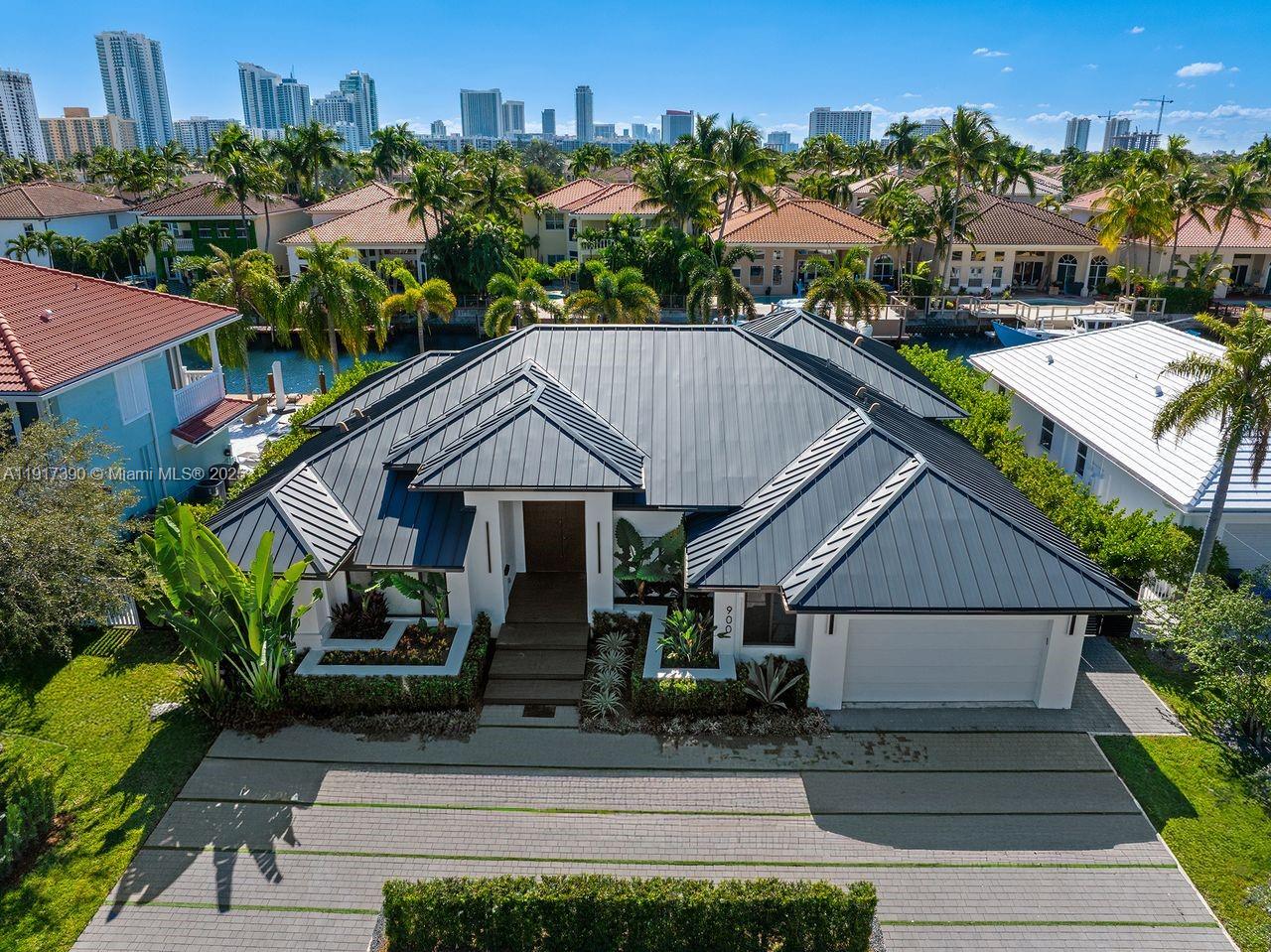 Just under 3,700 sq ft of completely remodeled modern luxury. This home delivers a wide-open floor plan with natural light pouring in the second you walk through the door. Inside, you’ll find flush linear diffusers, flush baseboards, European flush wood doors, and custom domed ceilings throughout. The custom Mia Cucina kitchen features leather granite counters, a double JennAir refrigerator, JennAir oven and steamer, and a built-in wine cooler. Smart-living upgrades include 16 security cameras and automatic curtains in the master, kitchen, and living areas. The home is topped with a double-ply insulated metal roof engineered to last 100 years. The backyard delivers true waterfront living with 100 feet of water frontage, direct ocean access with no fixed bridges, a new saltwater pool, jacuzzi, beach entry, new decking, raised yard, new seawall cap, concrete pilings, and aluminum gates — all finished with modern landscape lighting and an electric spigot for boaters.