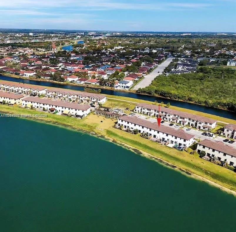 Beautifully updated lakefront townhouse located in the desirable Enclave South Phase 2 community. This 3-bedroom, 2.5-bath home features a modern open layout, updated kitchen and bathrooms, tile flooring on the main level, and laminate floors upstairs. Enjoy serene lake views from the living areas and backyard. Built in 2021, the property offers impact windows, ample parking, and low-maintenance living with HOA-managed amenities. Conveniently located near major highways, shopping, dining, and top-rated schools. A perfect primary residence or investment opportunity.