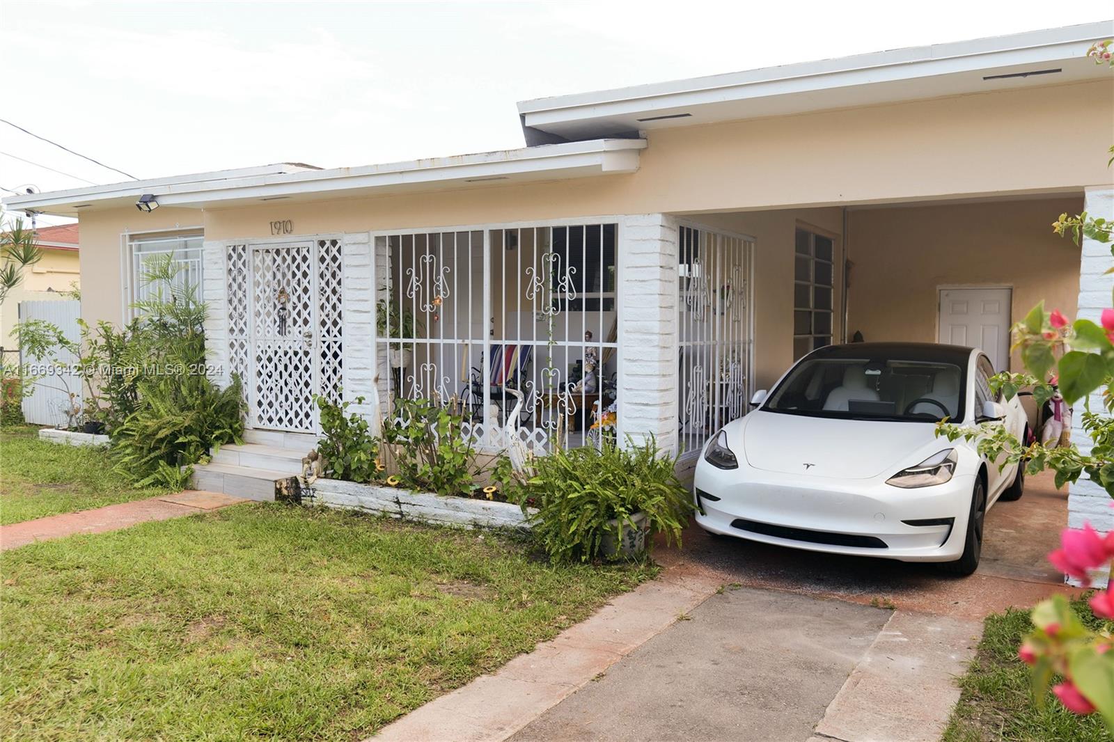Amazing opportunity to own a renovated home in Miami!! For Owner occupancy or Investors alike. No association in rapid appreciating area!! Three spacious bedrooms and three full baths with additional rooms.  Living room and dining room area lead to a large updated kitchen ready for your cooking. Roof, electric, bathrooms, floors and central air A/C all replaced and updated within the last few years. Brand new Rheem water heater. Large porches front and back of the home. large utility room / laundry room, plus a convenient carport with an electric charger. Priced to Sell! Ready to be occupied.