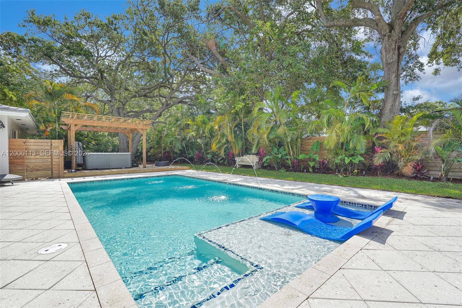 Meet the Breeze Block Courtyard Oasis, a fully restored & thoughtfully upgraded 3BR/2BA mid-century modern gem where timeless architecture meets modern-day convenience. Extensively renovated throughout & move-in ready, this residence offers the ideal blend of iconic design & modern functionality. Comprehensive upgrades include updated electrical, plumbing, a newer roof and pool, hurricane-impact windows & doors, new appliances & a brand-new driveway. Carefully preserved architectural character shines through signature mid-century details, including beautifully restored terrazzo flooring & the iconic breeze block design elements. At the heart of the home, the newly redesigned kitchen features ample storage, updated finishes, and an open-concept layout that flows effortlessly into the dining and living spaces, creating the perfect setting for entertaining and everyday living. Expansive natural light and seamless indoor-outdoor connectivity enhance the home’s warm, inviting atmosphere. The oversized property continues to impress with a private resort-style backyard featuring a 30ft saltwater pool, shaded pergola & jacuzzi spa, designed for year-round enjoyment. With abundant outdoor space and room for future expansion, the property offers exceptional flexibility to create your ultimate retreat. A rare opportunity to own a comprehensively updated architectural home that preserves authentic mid-century character while delivering the comfort & reliability of modern living.