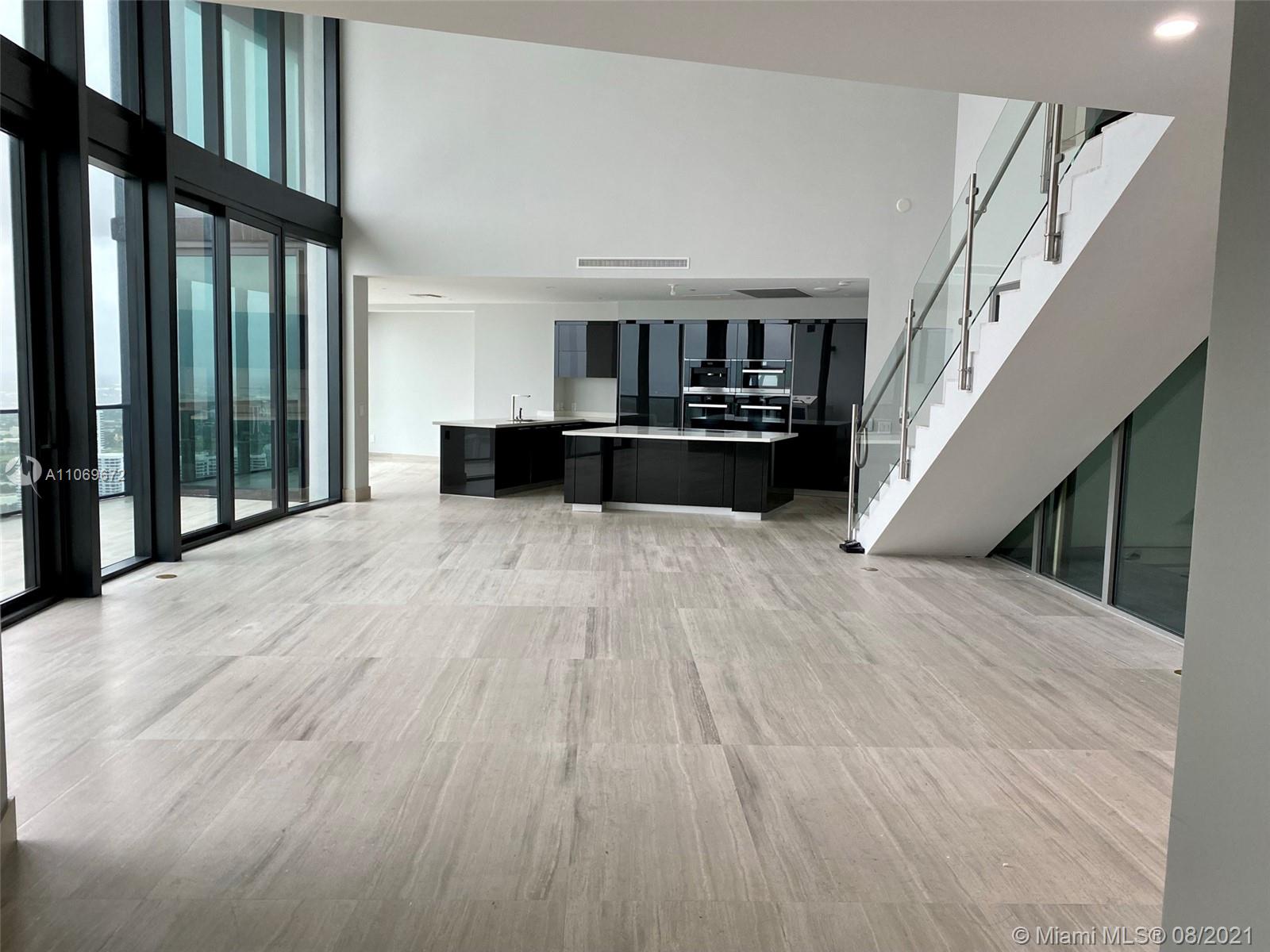 Exclusive one of only 16 duplex residences in the Porsche Design Tower. Completed with marble flooring, living & summer kitchen area, double ceiling living room & balcony, dining room, separate TV room on the 2nd floor, 2 private elevators, 542 SqFt of private sky garage with 2 parking spaces attached to the unit accessed by high tech car elevator, Miele appliances including wine cooler, induction cooktop, speed-microwave oven and warming drawers. Automatic Toto toilets with integrated bidet functions.  Amenities: Oceanfront gym & spa, pool & beach service, restaurants, theater, virtual golf, 2 race car simulators, private wine lockers, 24h valet, 24h exclusive concierge services and more.