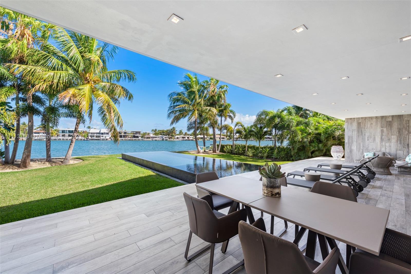 NEW CONSTRUCTION WATERFRONT MASTERPIECE located in Miami Beach gated community of Normandy Shores.
This 6,298 SF of new construction w/ 5,749 SF under A/C features 5 bedroom, 7.5 bath, and sits on 12,172 SF lot
w/ 78 FT of prime water frontage and incredible water views. Modern architecture with the utmost construction
quality and finishes. Elegant interiors, finest Italian Snaidero kitchen, Neolite countertops, Gaggenau & Sub-Zero
appliances. Onyx marble & luminaire sink in powder room. Designer lighting and Ornare closets throughout.
Indoor/ outdoor living at its best. Enjoy the tropical vegetation, state-of-the-art heated infinity pool and Al Fresco
summer kitchen. Luxury in every detail. Oversized two car garage and driveway for 6 additional cars. Enjoy
yachting, tennis and golf