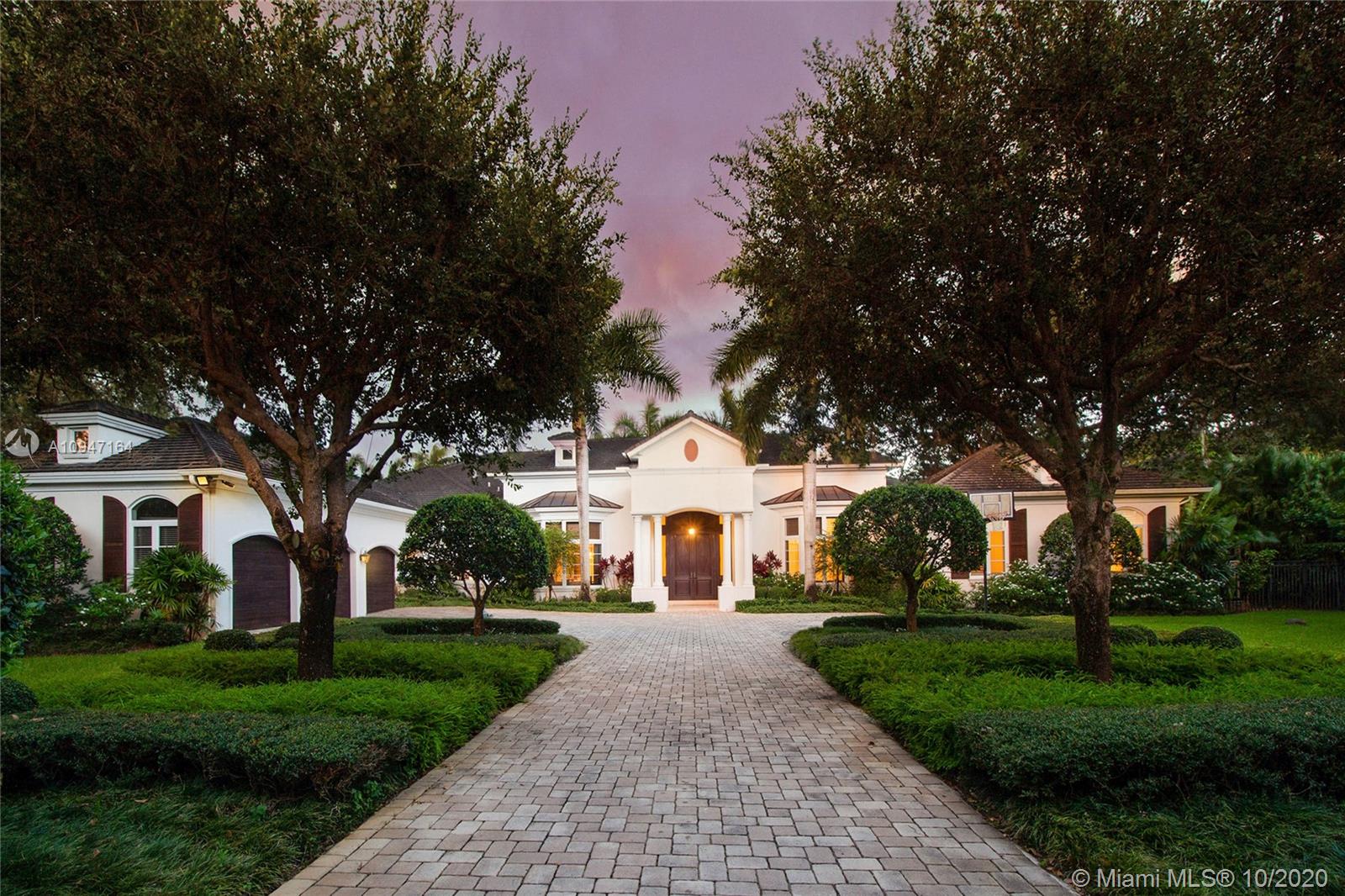 A sensational rare GEM! Transitional & Classic! Elegant & exquisite grand estate with all modern luxury!Gated on over 1.15 deep lush acres in sought after N Pinecrest! Spectacular & imposing entry! Soaring volume ceiling, gleaming marble & hardwood floors .Gorgeous formal living & dining rooms. Library/Office. Gourmet epicurean dream kitchen w/ top of line appliances! Lavish master suite w/sep.gym. Striking his and hers baths w/dressing area! Children's qtr with music/sitting area & playroom! Fabulous familyroom! All rooms w/pretty vistas !Reflecting and inviting oversized pools! Outdoor entertaining suited with full summer kitchen!. Sep.one bed guest quarter w/lovely bath! 3 car garage w/addl.carport! Luxurious appointments w/finest finishes throughout! Much more! Truly A MASTERPIECE!!!