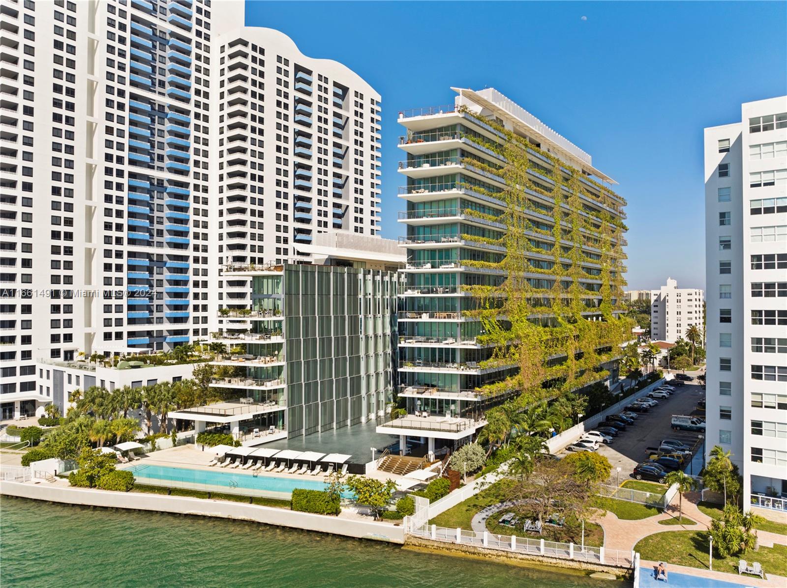 Welcome home to the sophisticated elegance of Monad Terrace, designed by the award-winning Jean Nouvel. This expansive corner residence boasts wraparound terrace with panoramic views of South Beach, Biscayne Bay & the Miami Skyline. Fully upgraded to perfection, this home features private elevator, custom blinds, a smart home system, security cameras, and a convenient laundry sink. The open kitchen and living area flow seamlessly onto expansive balconies. Inside, you’ll find teak wood and marble flooring, custom Calcutta marble countertops, Gaggenau appliances, and sleek custom cabinetry. Monad Terrace offers a boutique feel with just 59 residences, plus top-tier amenities including a bayfront infinity pool, sun deck, strength and cardio gyms, valet service, and 24/7 concierge.