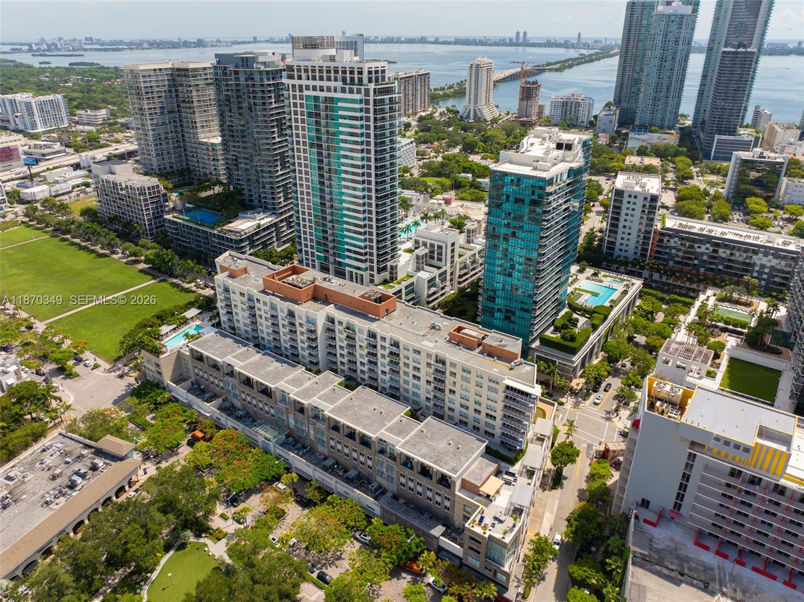 This condo is fully furnished and allows short-term rentals. A rare two-bedroom, two-bath corner unit with comfortable split bedroom layout & lowest monthly HOA. 10' ceilings, a private owner's closet, in-unit laundry, and one assigned parking space. The Midblock building is professionally managed with full resort amenities, 24-hour front desk, and an on-site management team providing peace of mind for full-time residents and visitors alike. Nestled between Wynwood and the Design District and inspired by New York’s SoHo district, Midtown is Miami's most pedestrian & pet-friendly neighborhood with endless restaurants, shopping, and fitness options.