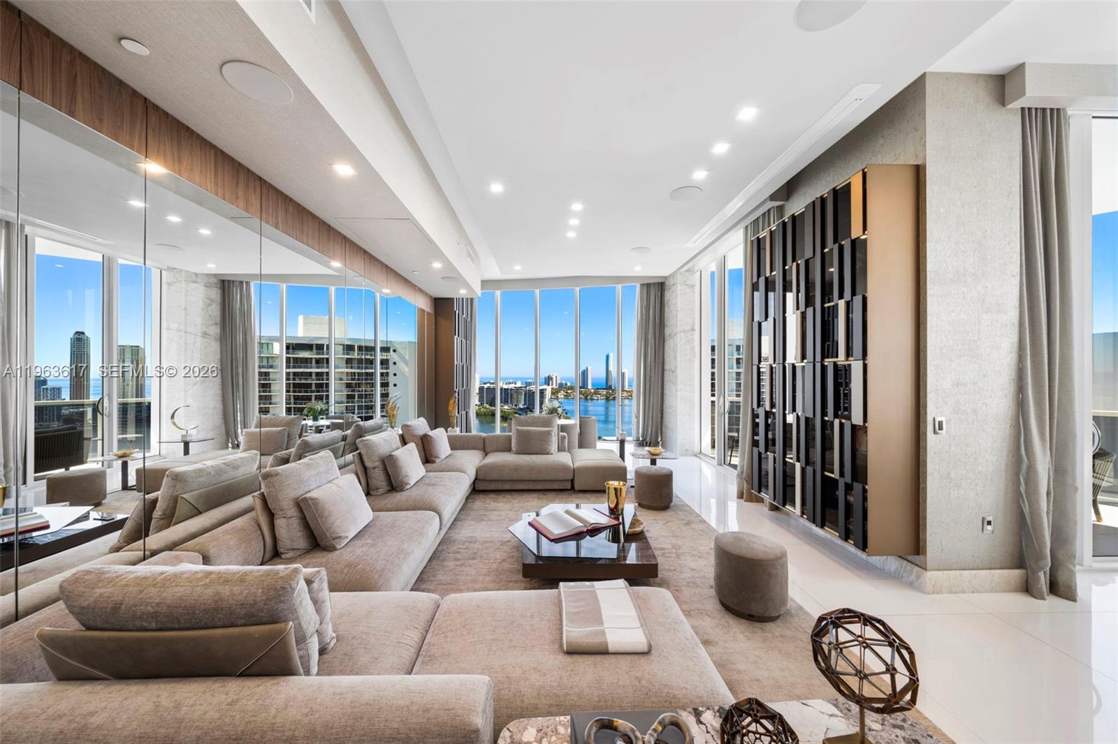 The Most Spectacular Penthouse in Aventura.

Designed by acclaimed designers Claudio and Valentina Micu and featured in multiple publications, this extraordinary residence spans over 5,000 SF and occupies half a floor with sweeping panoramic views of the ocean, bay, and skyline.

Soaring 12+ ft ceilings and impeccable custom finishes define the interiors, including backlit onyx feature walls, bespoke millwork and closets, lacquered detailing, and architectural wall treatments throughout. Every detail reflects exceptional craftsmanship and refined modern luxury.

Located in prestigious Williams Island, residents enjoy world-class amenities including a full-service spa, championship tennis, pickleball, panel, two restaurants, outdoor café, and a marina accommodating yachts up to 140 feet.

A remarkable offering. Call us to show.