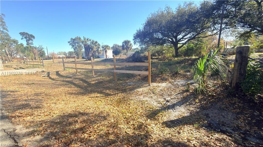 Spacious 0.32-acre vacant parcel in North Fort Myers. Zoned for mobile and manufactured homes, this versatile property allows for a mobile home, manufactured home, RV, or even a custom-built single-family residence. The lot is partially cleared and features an electrical pole located at the back right corner—adding convenience as you plan your build. Enjoy the benefits of a paved road, no HOA restrictions, and peace of mind knowing the property is not located in a flood zone—an increasingly hard-to-find combination. Ideally positioned with quick access to Del Prado Blvd N, Bayshore Road, US-41 (Tamiami Trail), and I-75, you’ll appreciate the ease of commuting and proximity to shopping, dining, and everyday essentials. Whether you’re planning a primary residence, seasonal retreat, or investment property, this lot offers flexibility and opportunity in a rapidly growing area.