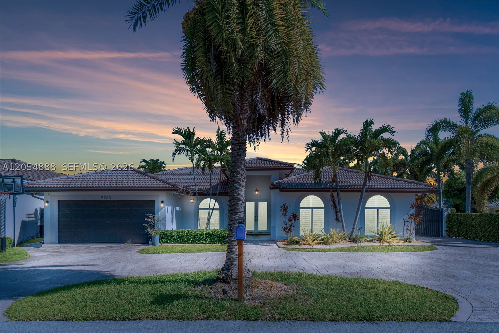 Welcome to Christina Estates, where comfort, style, and functionality come together in this beautifully upgraded corner-lot residence. This 4-bedroom, 2.5-bath home features a bright, open-concept floor plan enhanced by impact windows, plantation shutters, custom barn doors, and leased solar panels for added energy efficiency. Every detail has been thoughtfully updated, creating a modern and inviting living space perfect for everyday living and entertaining. Step outside to your own private tropical retreat featuring a spacious covered patio, sparkling pool, and charming Tiki hut—an ideal setting for relaxing or hosting family and friends year-round. Conveniently located in one of Miami's most desirable neighborhoods, just minutes from top-rated schools, parks, shopping, dining, and major highways. This is a rare opportunity to own a truly move-in-ready home that offers the best of South Florida living.