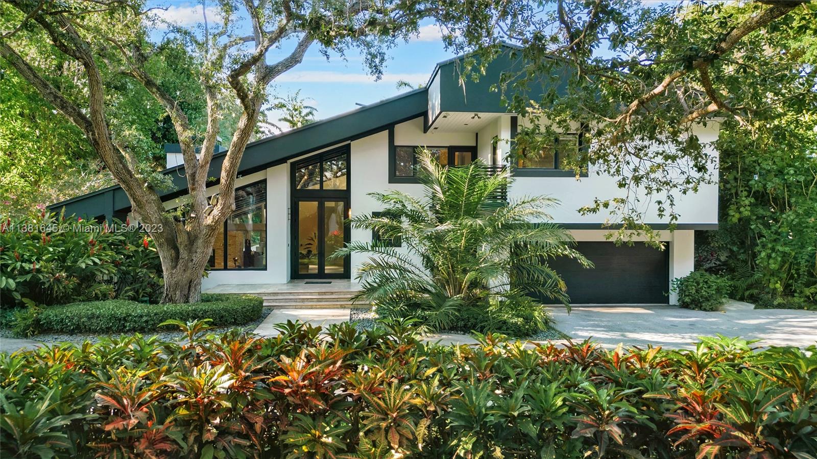 Welcome to your own private oasis in Miami! This property comprises 2 lots, providing ample space for luxury living. Boasting a unique Tulum vibe that runs throughout the home, this is the perfect retreat for those seeking a peaceful escape. The full-sized tennis court is perfect for staying active, while the sparkling pool surrounded by lush greenery provides the ultimate oasis. The gourmet kitchen is a chef's dream, featuring high-end appliances and plenty of counter space. With 5 bedrooms and 6 baths, there's plenty of space for everyone to relax and unwind. The beautifully designed living space features natural materials, and plenty of natural light, creating a serene and welcoming atmosphere. 
Includes Adjacent Vacant Lot with 43,560 SF per Miami-Dade Tax Roll Folio #30-5009-00-0020.