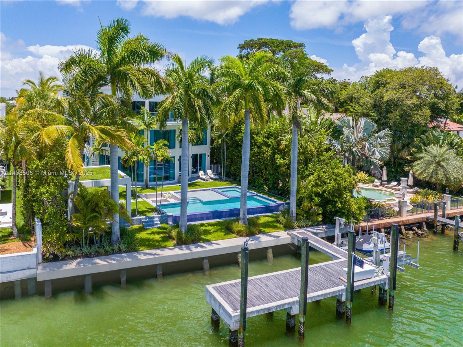 New Neo-Classic, one of a kind, 3 Story waterfront home. Fully Furnished, equipped, and adorned by Argent Design. Open Atrium entry with water features and glass. Stunning Circular glass 30 ft tall center piece staircase with curved hand rail. 15,000sf living area, 8 bdrm/6 full bthrm/2 Half. Large kitchen touch sensor cabinets. Wolf, Gaggenau and Sub-Zero appliances, 2 full pantry’s and Wine storage. Large full floor primary room with 2 large terraces, its own family room, midnight kitchen and office. Game area, 2 laundry rooms and Elevator. Heated pool with sunken sitting area, large cabana w outdoor kitchen, new concrete dock with 79’ of wf. Lush landscaping with lighting and security cameras. 4 car garage, circular driveway all marble, with 2 custom wood gates. Fully automated home.