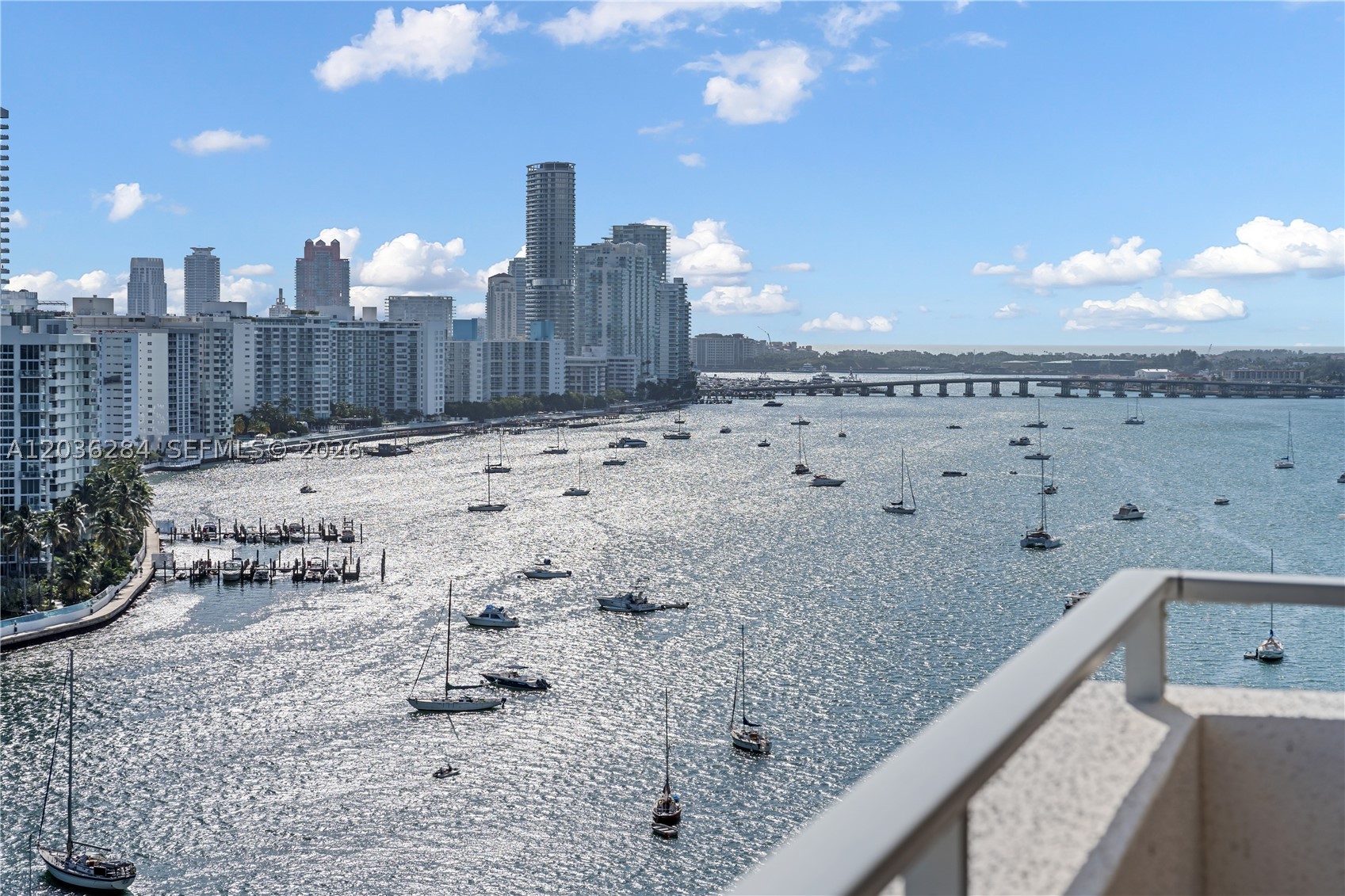 Beautifully maintained 2-bedroom, 2-bath residence at Costa Brava on Belle Isle, offering sweeping bay and skyline views from a private balcony. The unit includes a dedicated parking space and access to exceptional amenities, including a heated waterfront pool, fitness center, rooftop terrace with panoramic 360° views, bike storage, community room, vehicle wash area, on-site EV charging stations, and pet area. Well-positioned within the building and attractively priced, this residence presents a compelling opportunity to move right in or reimagine the space to suit your vision. Ideally located just moments from Sunset Harbour's acclaimed dining, shopping, and parks, with convenient access to South Beach, Downtown Miami, and Brickell.