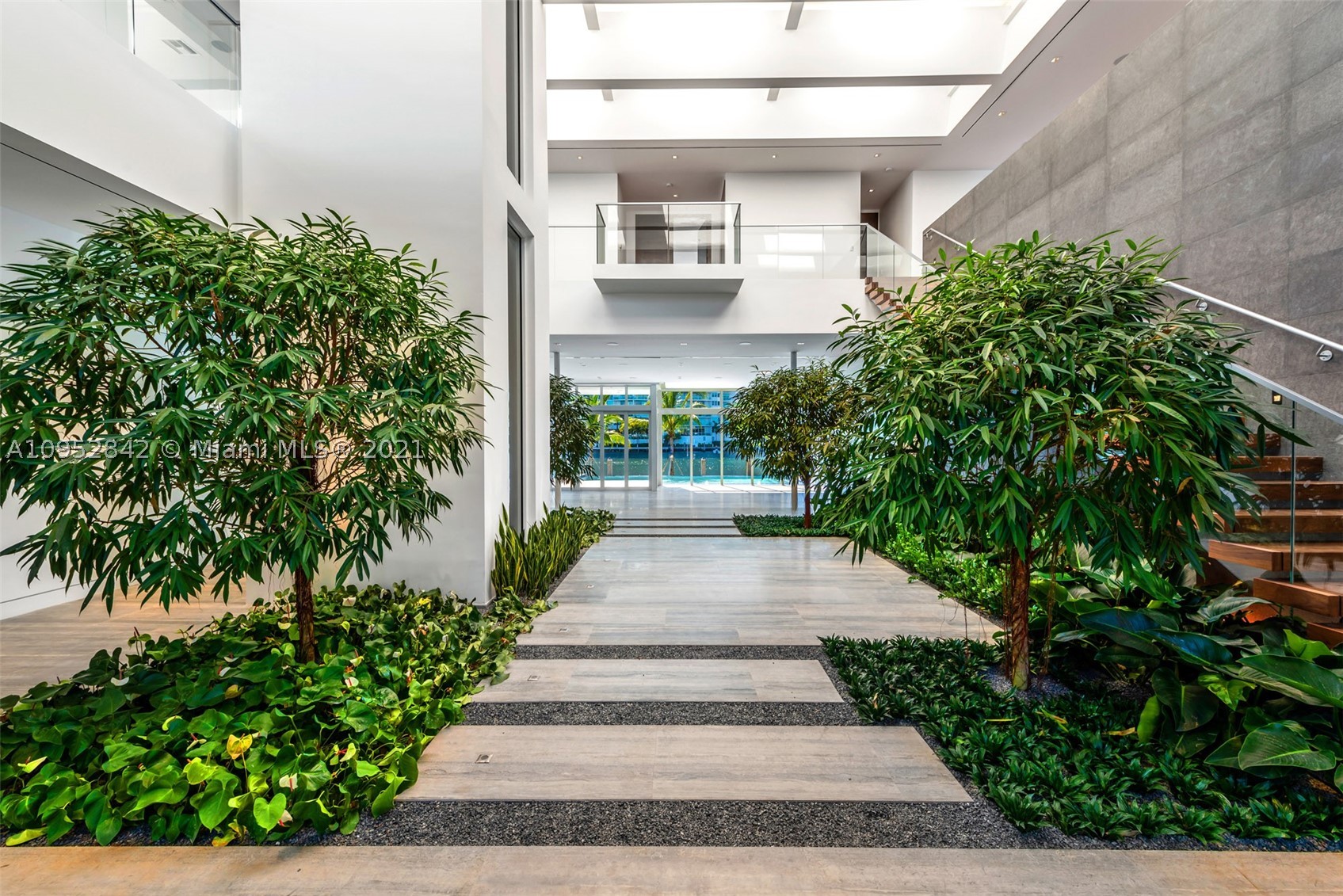 Welcome to your own universe within the gates of Golden Beach. Located directly upon the main intracoastal waterway, this is as prime of a location as it gets within the neighborhood. Offering tremendous ceiling heights, a modern open floorpan, a phenomenal fluid flow of design from room to room, and oversized bedrooms, this is the oasis you have been dreaming of. A short walk to the private beach, as well as the nine private parks, all under the supervision of the private police department, experience the magical world of Golden Beach.