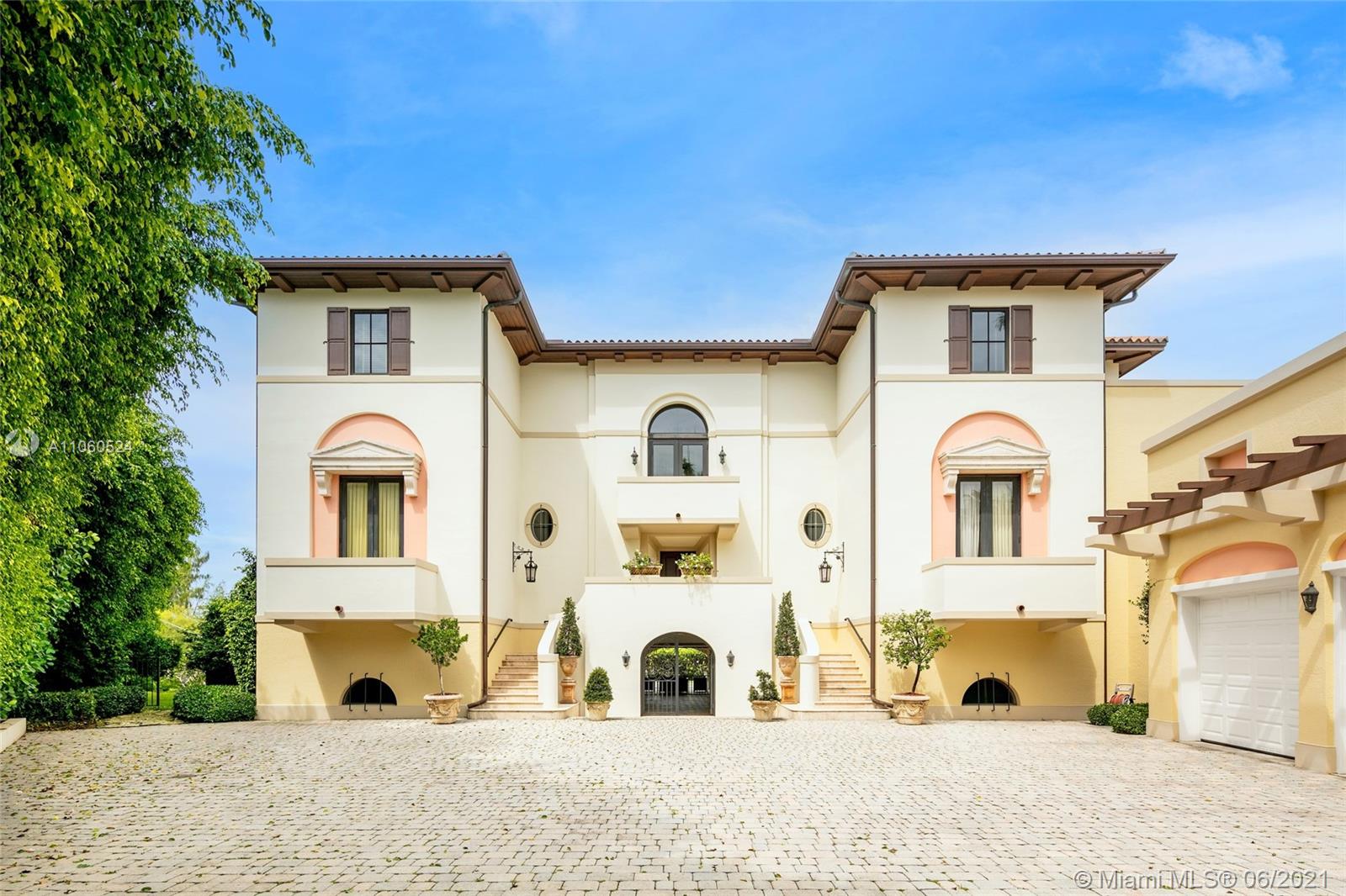 Enjoy the ultimate in waterfront living in this Santa Barbara style oasis. Located in the coveted Cocoplum community on a quiet cul de sac on an entirely secluded corner lot, your private waterfront vistas are beautiful/lush greenery. Drive through private gates to a majestic entrance that takes you away to the Spanish countryside. Boasting double height coffered ceilings, 5BD/5+2BA, 7,278 SF on a 17,696 SF lot, features include a gourmet kitchen w/ top of the line appliances, living room w/ a built-in bar, oversized formal dining room, media room & a guest suite. The luxurious master suite offers a spa-like bathroom & French doors opening to a waterfront balcony. The magnificent waterfront offers 202’ on the water, sparkling pool, verdant gardens & a private boat dock.