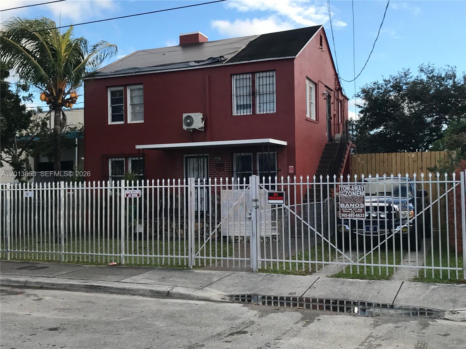 RARE ALLAPATTAH INVESTMENT OPPORTUNITY FEATURING A D2-ZONED INDUSTRIAL LOT AND AN INCOME-PRODUCING DUPLEX. This hybrid asset offers immediate cash flow from two residential units alongside heavy industrial utility in the heart of Miami’s industrial corridor. The 7,000+ SF fully secured site includes five steel storage containers (two 40ft and three 20ft), ideal for contractor storage, wholesale, or fleet parking, with strategic access to I-95 and SR-112. The D2 (Heavy Industrial) zoning provides maximum flexibility for owner-users or future redevelopment. Seller is open to Interest-Only Seller Financing, allowing for a fast and seamless closing. Please note: Owner requires a 60-90 day post-closing occupancy period to relocate existing business inventory. While the storage containers are included in the sale, all automotive inventory, specialized tools, and Jaguar parts are strictly excluded. This is a unique opportunity to acquire premium industrial land with established residential income.