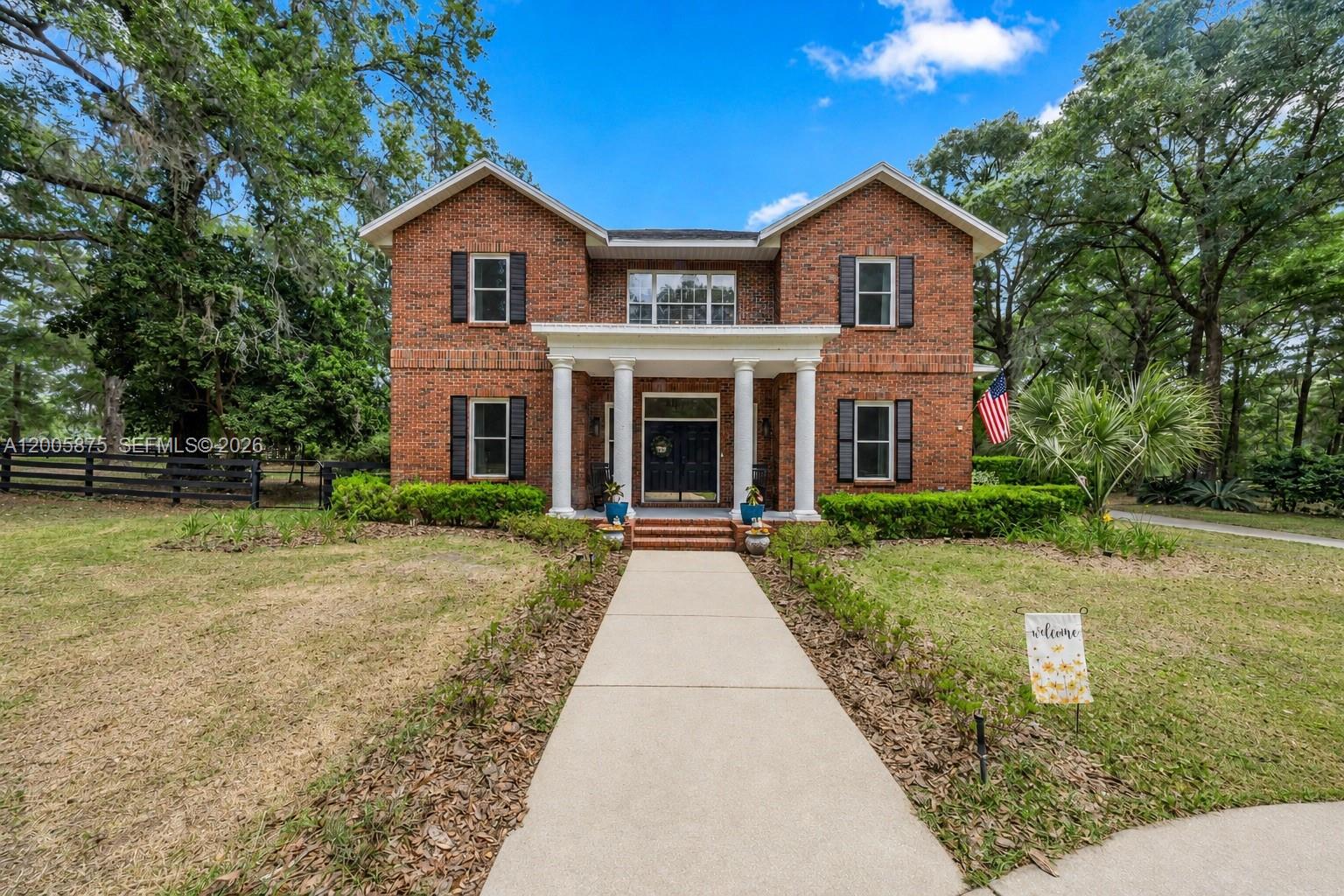 PRICE IMPROVEMENT – NOW OFFERED AT $1,019,000! Seller has repositioned this stunning estate to create an exceptional opportunity for today's buyer. Properties offering this combination of acreage, privacy, gated-community living, modern upgrades, a resort-style pool, and over 3,400 sq ft of living space are rarely available at this price point. Welcome to your private retreat in Turning Hawk Ranch II. Situated on 2.3 beautifully manicured acres, this two-story brick estate features 5 bedrooms, 2 offices, 4 bathrooms, and a flexible floor plan ideal for multi-generational living. A highly desirable first-floor bedroom and full bath provide the perfect space for guests or extended family. Inside, you'll find soaring ceilings, hardwood floors, and a functional layout designed for everyday living and entertaining. The gourmet kitchen offers granite countertops, a large island, built-in oven, induction cooktop, and abundant cabinetry, opening to the living room with a gas fireplace. Enjoy Florida living with a fully enclosed solar-heated saltwater pool surrounded by lush landscaping. The primary suite features an updated bath, while additional bedrooms offer comfort and flexibility. Notable upgrades include a whole-house generator, energy-efficient windows, solar features, and a newer roof. Conveniently located near Santos Trailhead, the Florida Greenway, shopping, dining, top-rated schools, and Ocala's equestrian venues. Low HOA ($1,200/year)