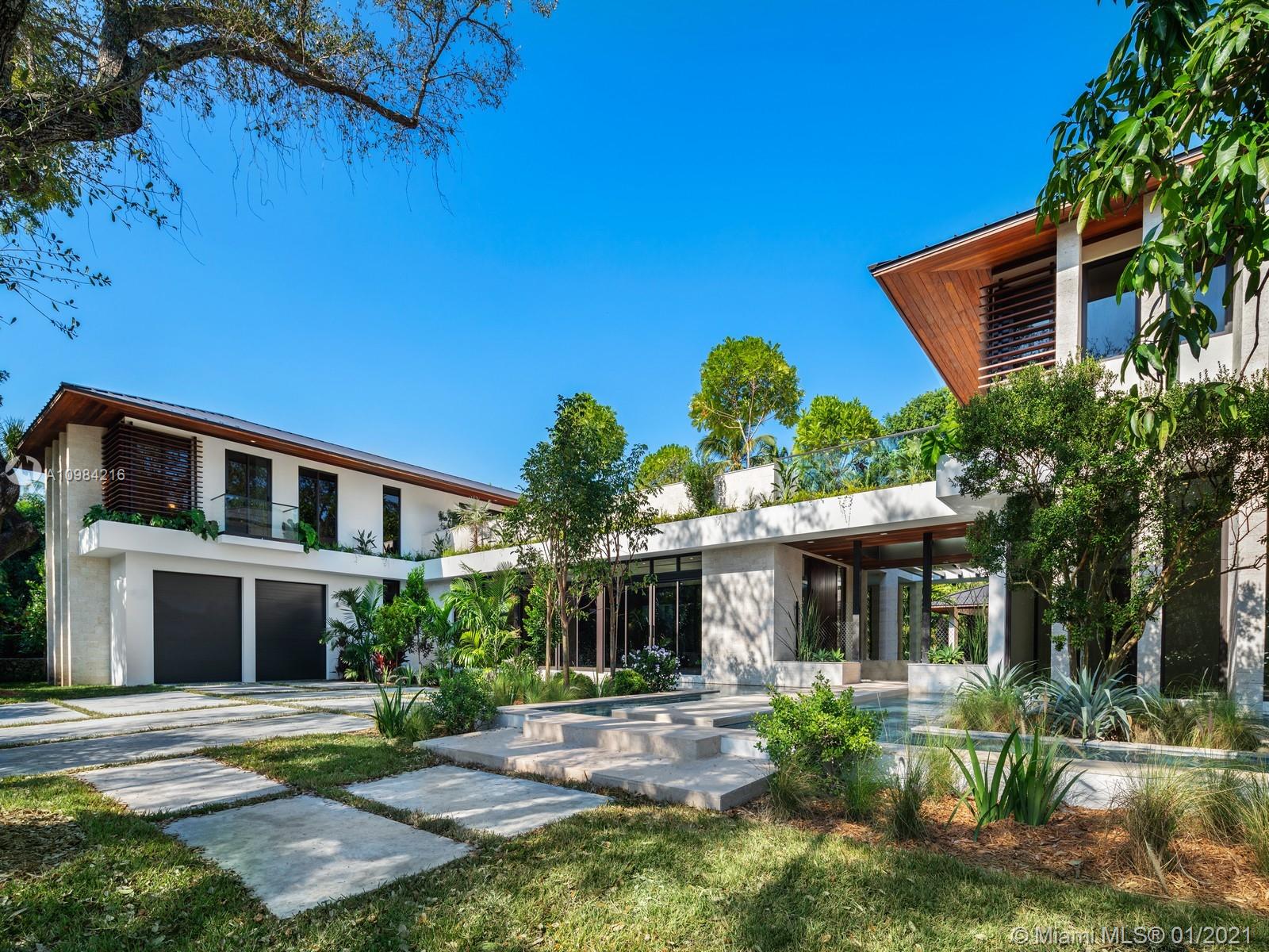 This magnificent new construction residence designed by Miami architect Cesar Molina, redefines the intersection of luxury and raw materiality. It is secluded on a 21,680 sf South Coconut Grove gated lot. The property features a 5 bed, 5.5 bath main house with a 2 bed, 2 bath connected guest house. Bright and spacious high-ceilings define the modern interiors. The kitchen features European cabinetry, top-of-the-line appliances and large central island with a family room and covered terrace. The bedroom level features large ensuites with luxury bath finishes opening to the upper garden terrace complete with a plunge pool and connection to the guest house perfect for a gym and home office. Enjoy expansive covered exterior living spaces, large pool with spa and BBQ pavilion with bath.