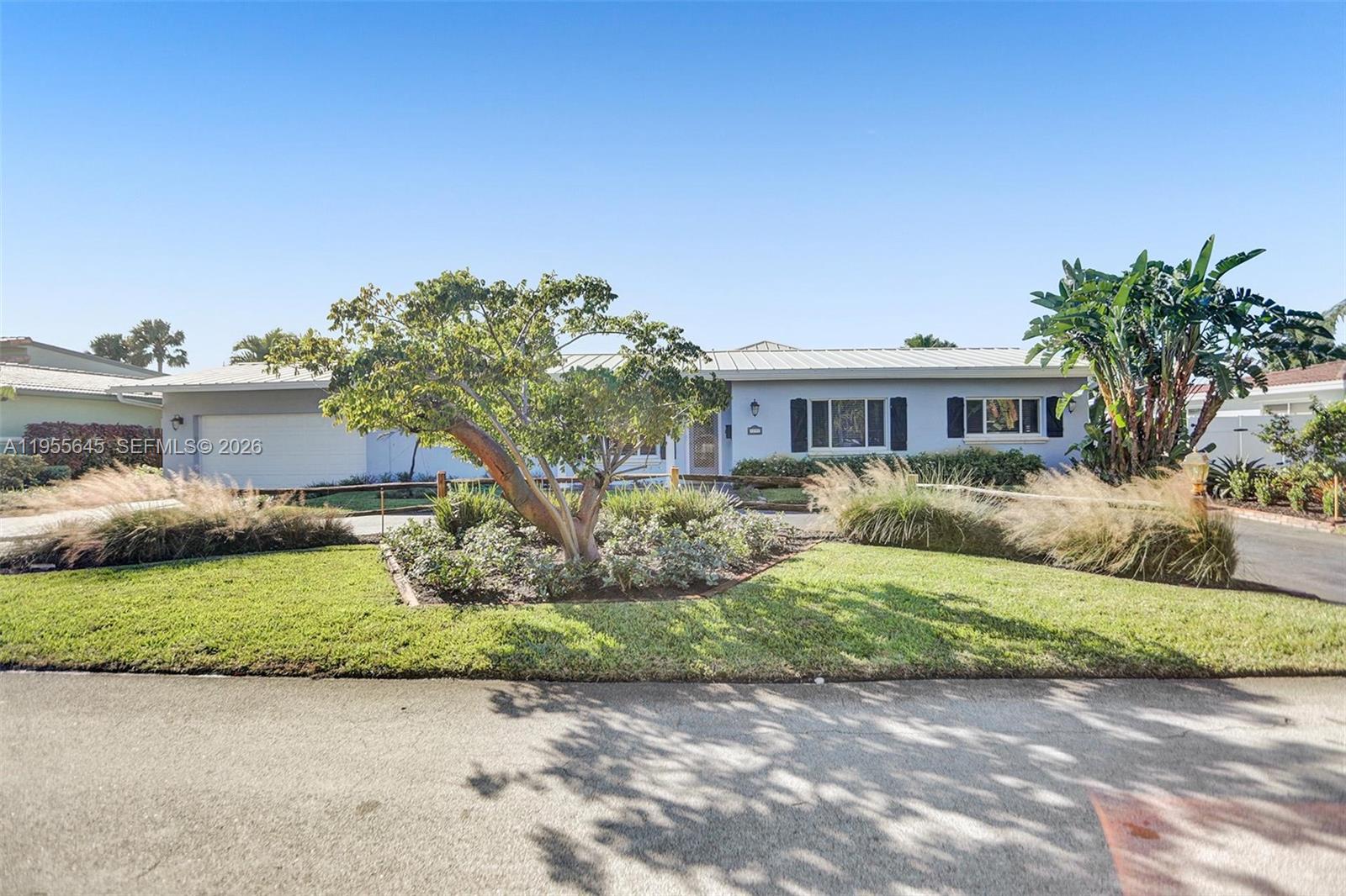 Move-in ready and beautifully remodeled, this stunning Lighthouse Point home features a brand-new flat roof, 6 spacious bedrooms, and 4 modern bathrooms. Soaring high ceilings enhance the open, airy feel, while extensive upgrades shine throughout the home. Step outside to a huge backyard with a massive resort-style pool—perfect for entertaining or relaxing. Gorgeous bathrooms, upgraded bedrooms, and thoughtful finishes make this home truly special. Just bring your toothbrush and move right in