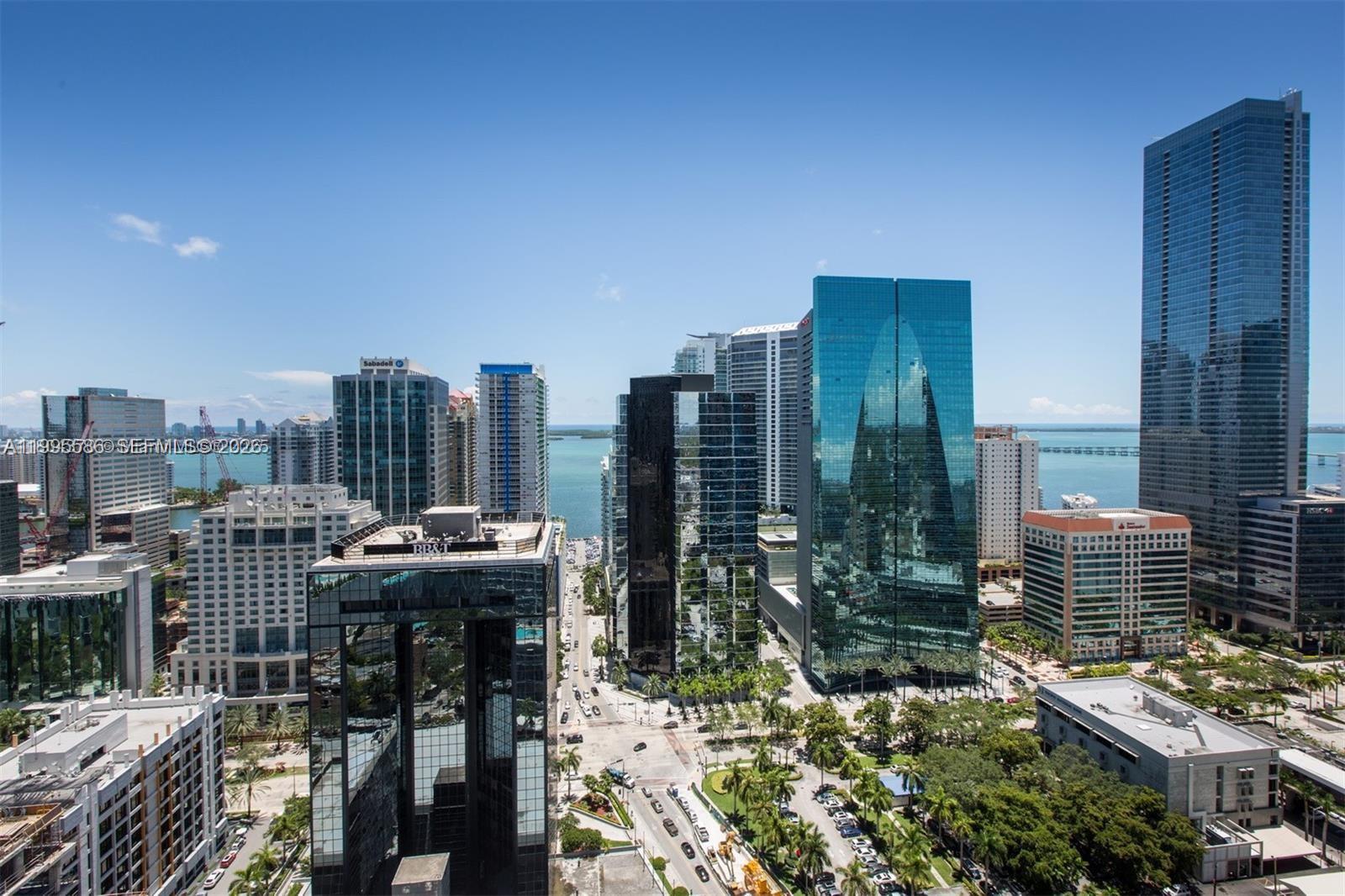 Exceptional Brickell Penthouse with Breathtaking Panoramic Views. Rarely available 3-bedroom, 2-bath corner penthouse featuring a stunning wraparound balcony with views of the Intracoastal Bay and Miami skyline, along with the privacy of no direct neighbors. Ideally located in the heart of Brickell, just steps from Brickell City Centre, with top restaurants and conveniences right below the building. This luxury residence showcases elegant marble flooring and marble bathrooms throughout, complemented by granite countertops, stainless steel appliances, and impact-resistant doors and windows. Additional highlights include two assigned parking spaces plus valet, with internet, cable, and water included. Residents enjoy resort-style, 5-star amenities including a state-of-the-art fitness center, swimming pool, business center, club room, and 24-hour valet and concierge services.  SELLER IS HIGHLY MOTIVATED AND READY TO MAKE A DEAL.