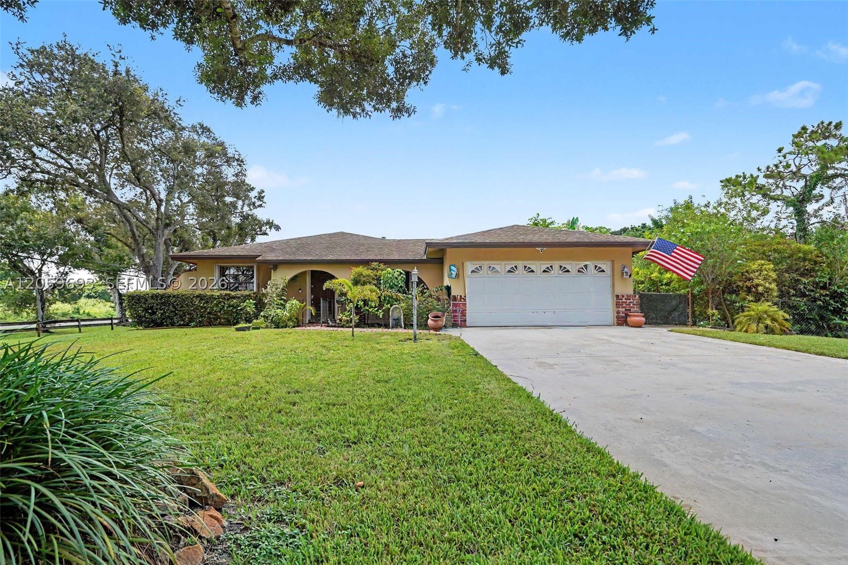 Exceptional estate in the heart of Davie! Perfect for multi-generational living. This unique property features a 2,700+ sq. ft. main residence with 4 bedrooms and 2 bathrooms,and a 2 car garage, plus an aprox 1,200 detached 2-bedroom, 1-bath guest house with its own private driveway, kitchen, laundry, and garage—ideal for extended family, guests, a home office, or creative space.

The spacious primary suite offers two walk-in closets and a luxurious bath with a whirlpool tub, dual vanities, bidet, rain shower, and built-in hampers. The main home also features a large granite kitchen with abundant counter space, prep sink, expansive living areas, an open family/dining room, and a versatile fourth bedroom currently used as a home office. Additional highlights include dual A/C systems, a large laundry room, pantry, and a reinforced safe room.

Enjoy a spacious lot with room for boats, RVs, and recreational vehicles, and an additional large workshop/one-car garage. The property is surrounded by mature fruit trees including avocado, mango, lychee, banana, star fruit, mamey, and ackee. Conveniently located near Davie's trail system, top-rated schools including Country Isles Elementary, and the 100-acre Davie Passive Park just across the street.