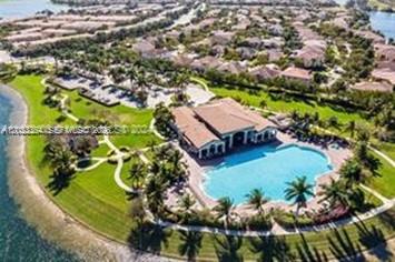 Great Condo in the Guard Gated community of Isles of Bayshore. Features: Completely refurbished. Ground floor unit, canal front, split bedroom plan, tile floors, new kitchen (cabinets & stainless-steel appliances) with breakfast nook opens to a nice patio with a great view of the canal, washer/dryer inside, hurricane shutters, bright & airy. Enjoy the luxurious community with clubhouse, pool, gym and playground. Quick access to the Turnpike (Exit 216 ST). Close to shopping and schools. About a mile from the Black Point Marina & Park.