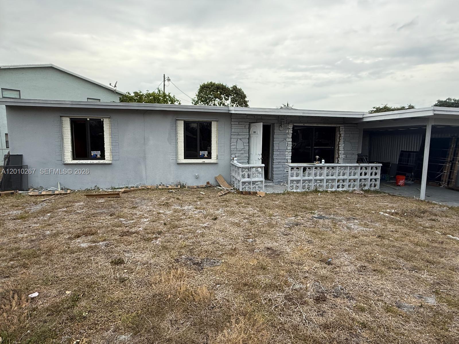 This is a diamond in the rough—a hidden gem in a spectacular location—offering the opportunity to transform it into the home of your dreams; it represents a fantastic project to undertake. The property sustained fire damage affecting no more than 25–30% of the structure; a complete roof replacement is not required, as the damaged section can be repaired. Impact-resistant doors and windows were installed throughout the property in 2025. The fascia has been repaired, the home's exterior has been painted, and the lawn is mowed regularly in compliance with city requirements. The seller is highly motivated to close the transaction as soon as possible.