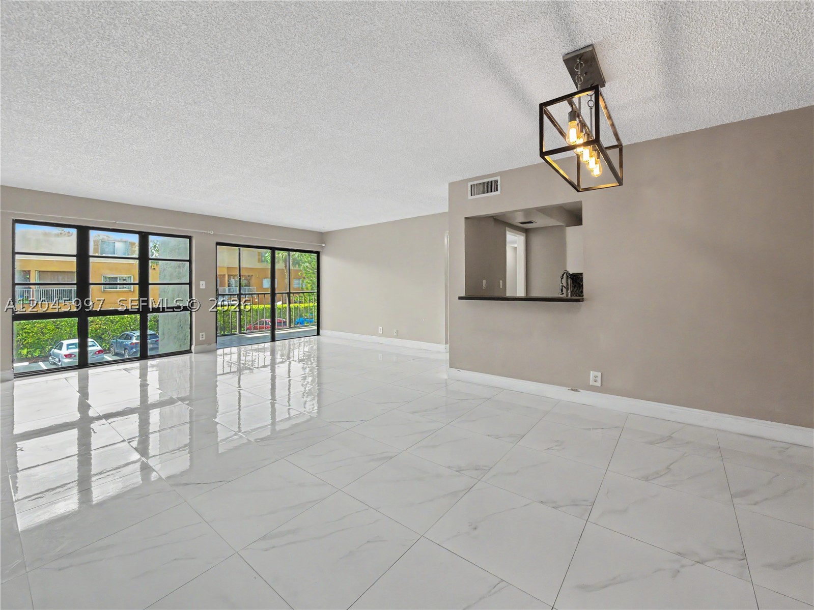 Beautifully updated unit in an immaculate, well-managed Class A building that passed the 40-year certification. Updates include new roof, AC (2023), water heater (2023), new thermostat, updated flooring, elevators, and pool/pool bathroom. Gated balcony with partial water view. Two assigned parking spaces (one covered), plus first-floor storage. Resort-style amenities include pool, 4 tennis courts, clubroom, and tiki hut with outdoor BBQ. HOA $480/month, water included. Prime central Kendall Lakes location. A must-see for homeowners seeking a stable, well-run community. No Rentals, Owner-Occupants Only