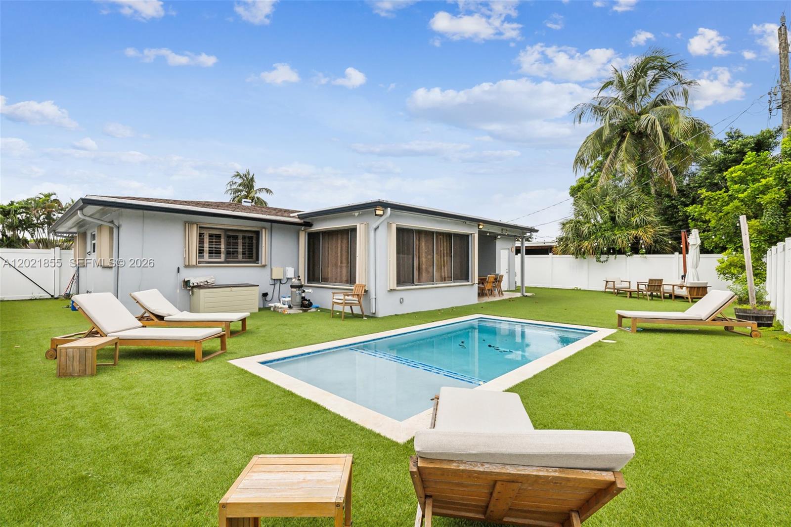 Cozy home with a beautifully-fully updated backyard! Pool, fence, covered dining area, and top of the line syntetic turf! New pipes and AC. Text listing agent